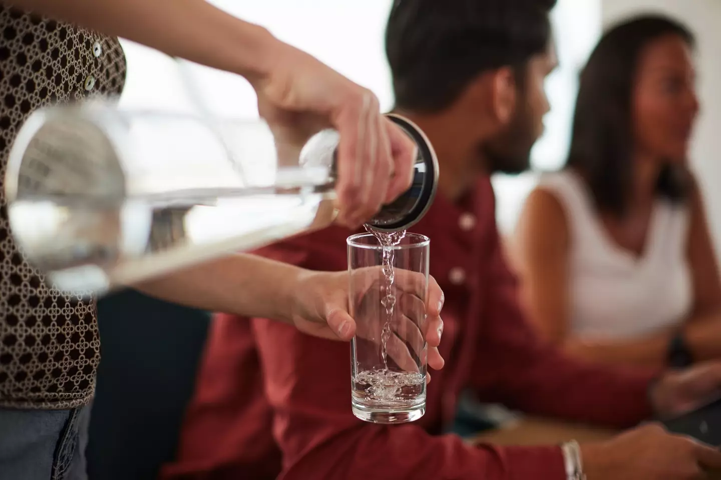 Sneaking some bottle H2O in the glass while his back's turned? (Tempura/Getty Images)