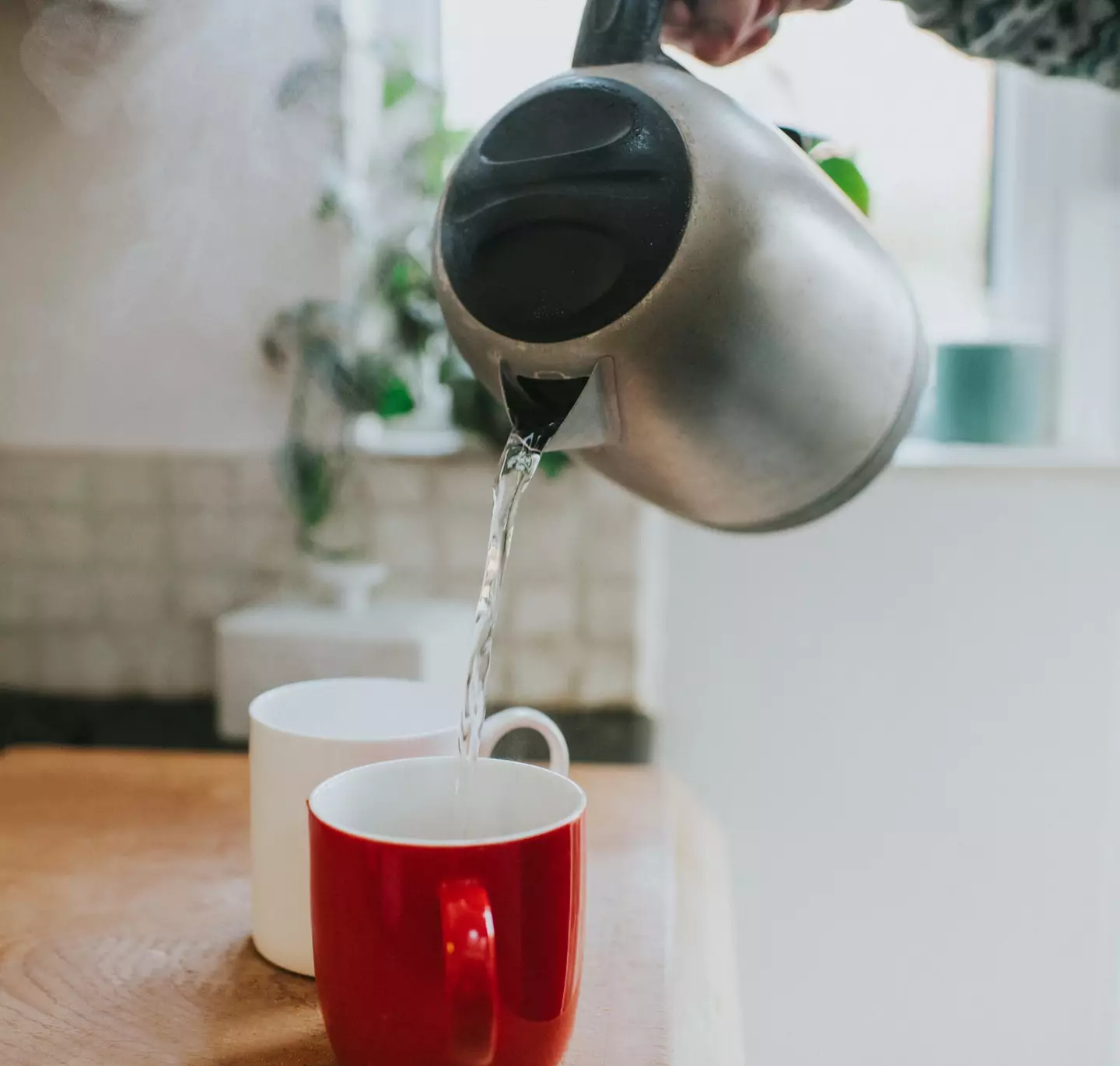 Top up your coffee with hot water once the granules have dissolved in cold water (Catherine Falls Commercial/Getty Images)
