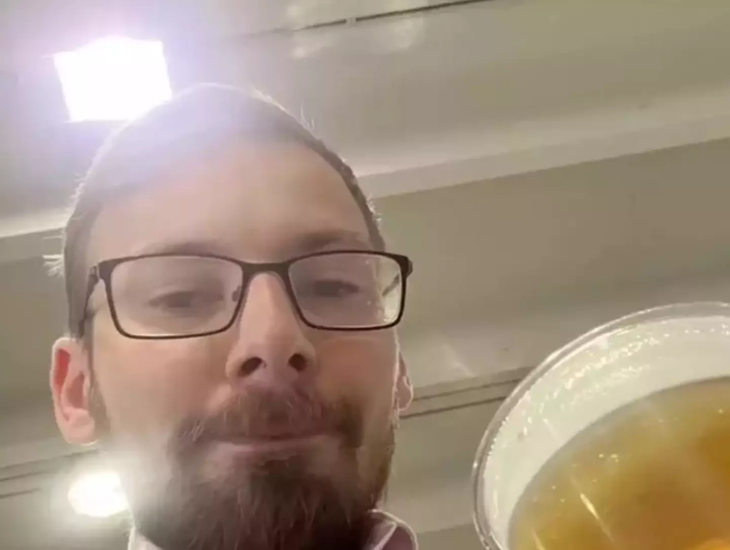 Jon tucking into one of his 2000 pints - @j0nmay via TikTok