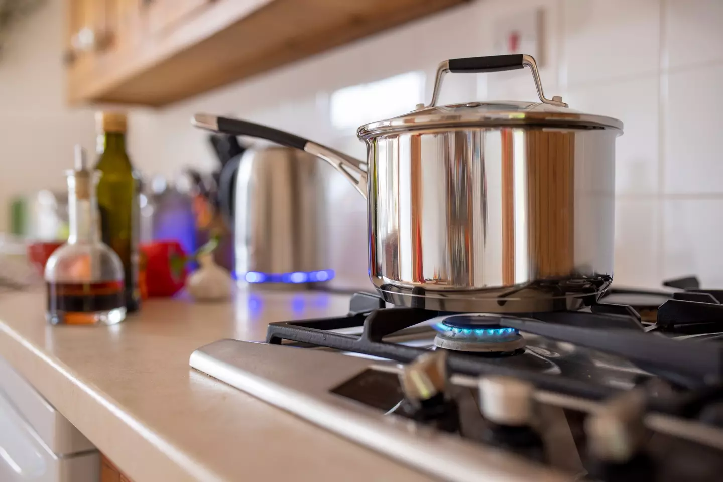 Stock image of a cooking pot on a gas stove (SolStock/Getty Images)