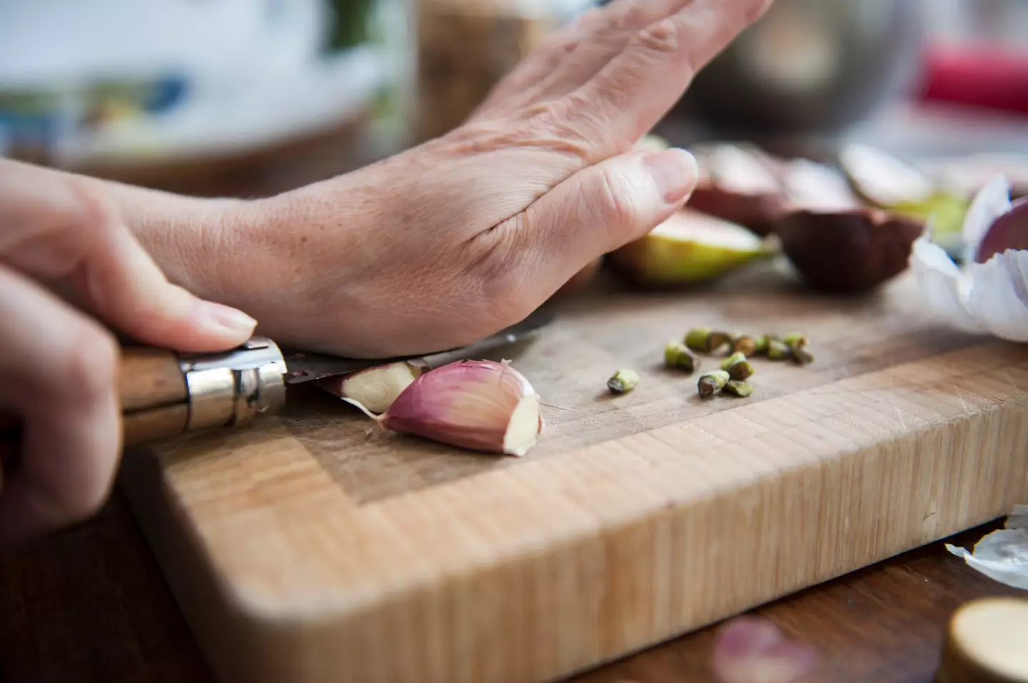 You can cut the core out of a clove if it's become visibly distinct from the rest of the garlic, removing some bitterness (Lucy Lambriex/Getty Images)