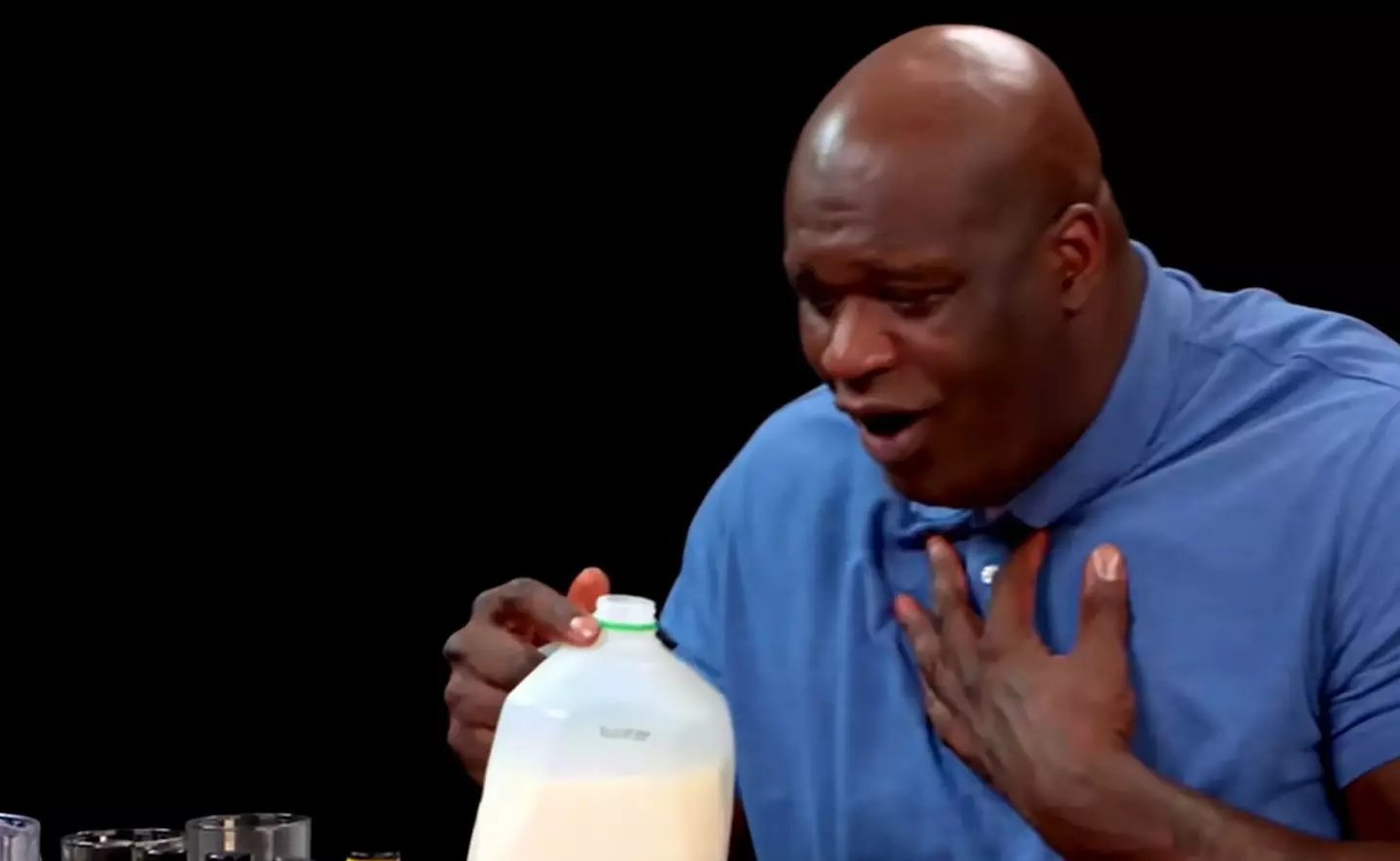 Shaq reaching for the milk as the spices take their toll (First We Feast/YouTube)