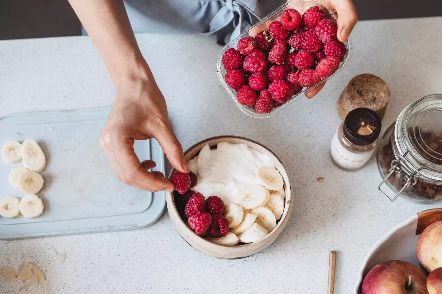 Plain yoghurt, fruit and honey is a better way to get your sugar kick (FreshSplash/Getty)