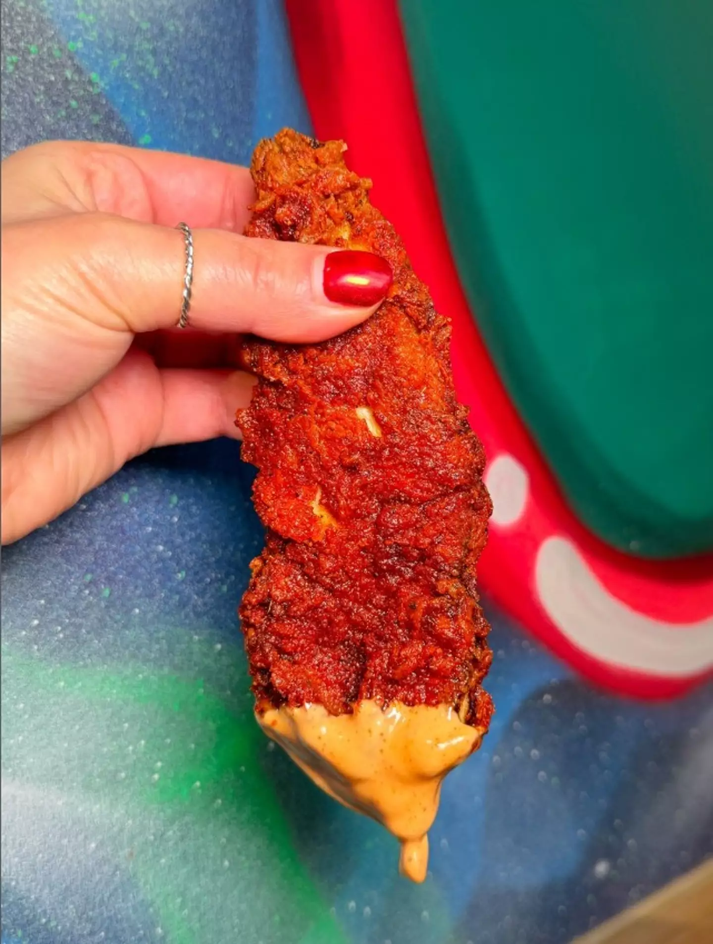 A chicken tender from Dave's Hot Chicken.