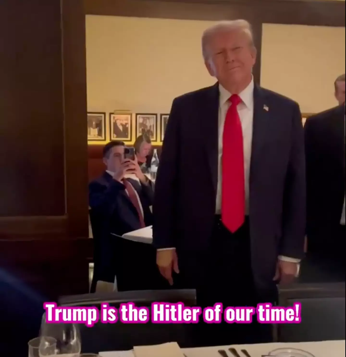 A still from the video in which Trump is targeted in the restaurant (YouTube / Code Pink)