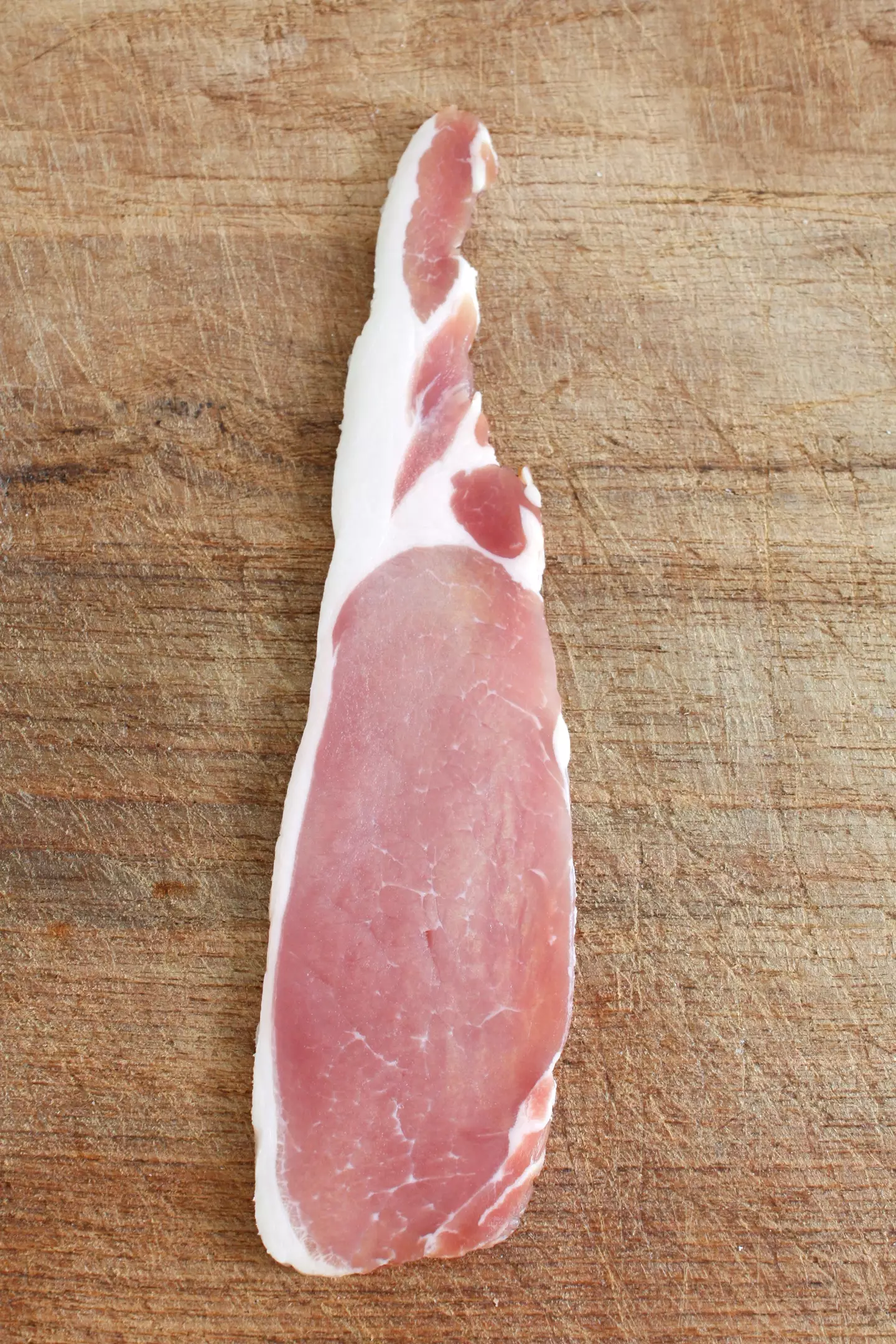 Raw bacon can sometimes have a bit of a green shiny tint.