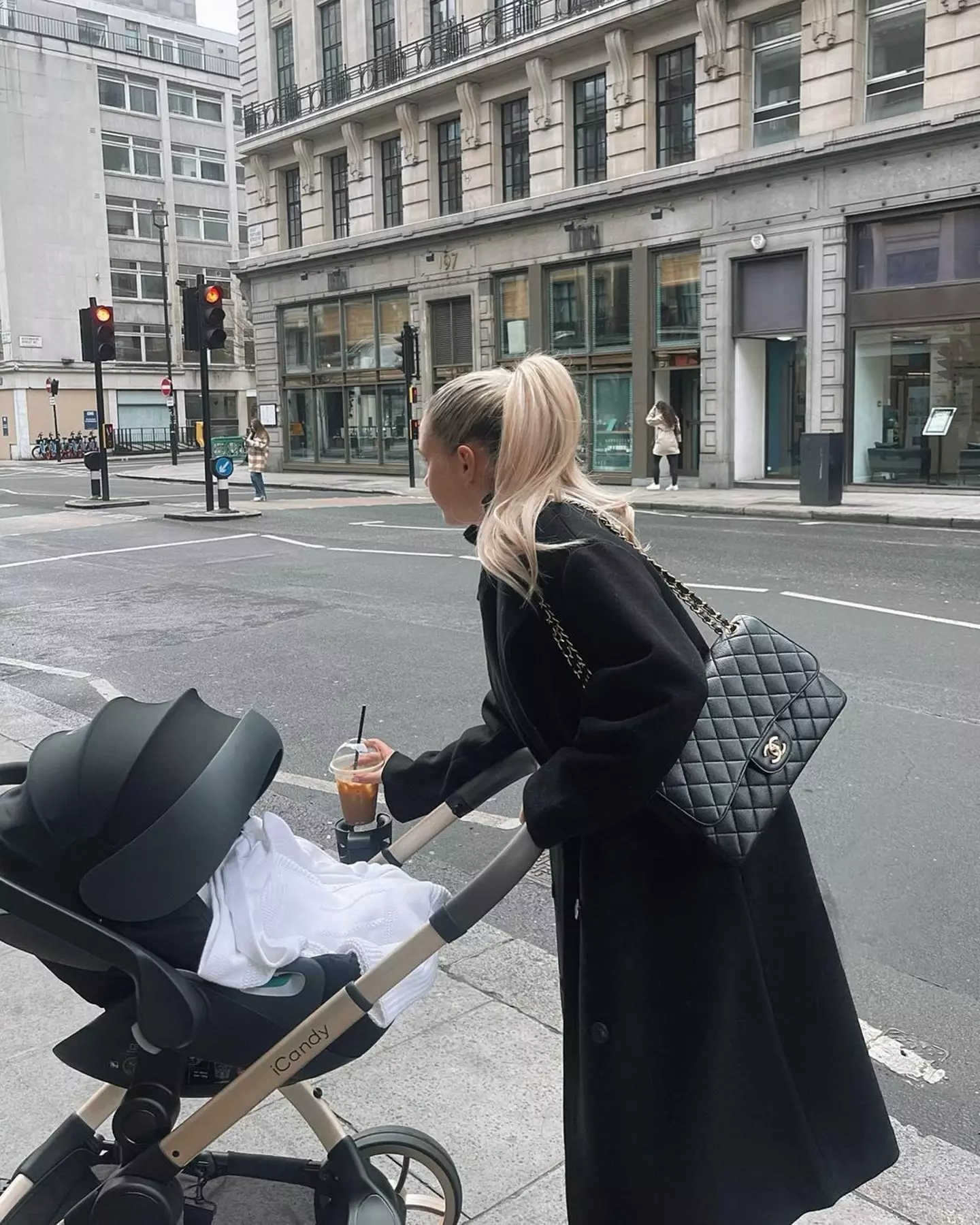 Juggling a coffee and a buggy is a skill, to be fair.