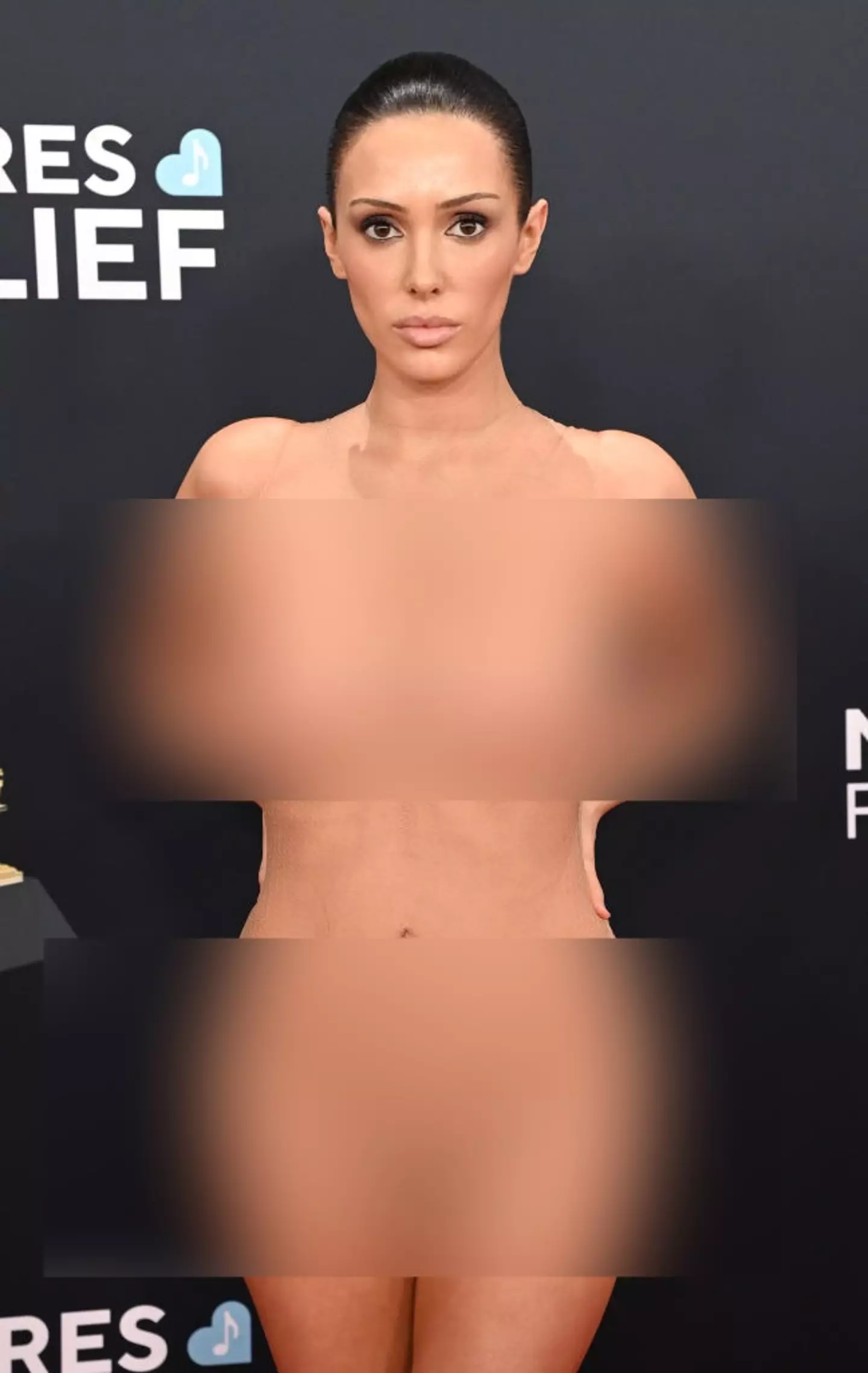 Bianca Censori wore a see-through mesh dress at the Grammys on Sunday, causing controversy worldwide (Jon Kopaloff / Stringer / Getty Images)