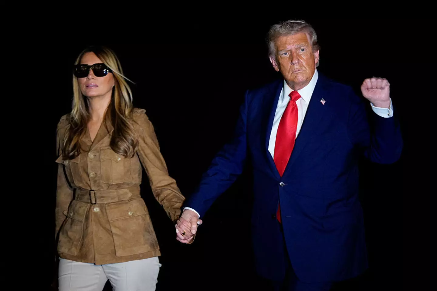 However, people have been left confused by Melania's choice to sport large sunglasses in the dark (Andrew Harnik/Getty Images)