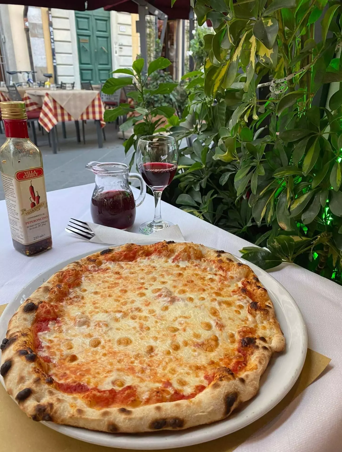 Katie tucked into pizza and wine.