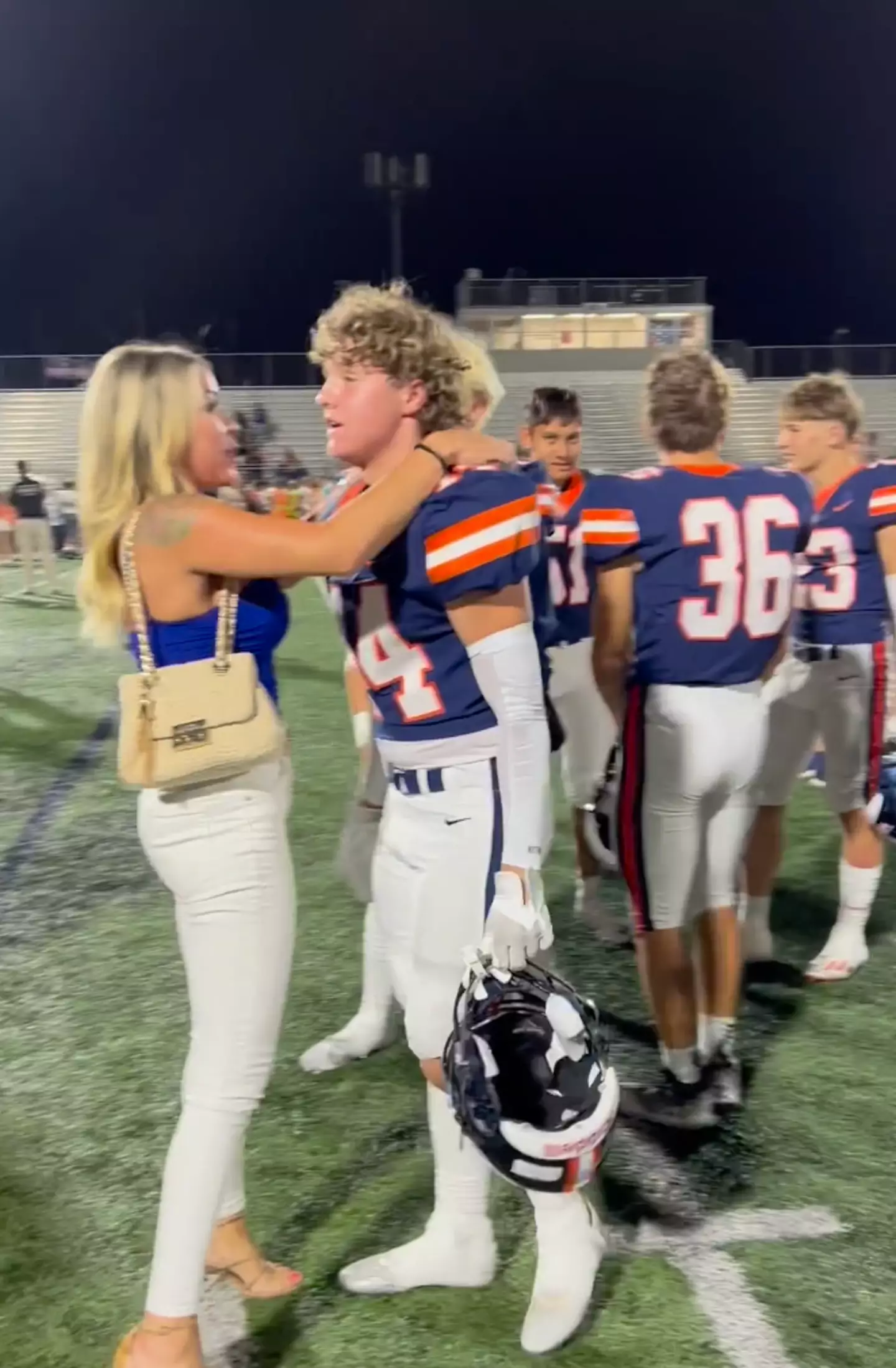 Amber Wright hugged her son Brixton after his team had won a home game.