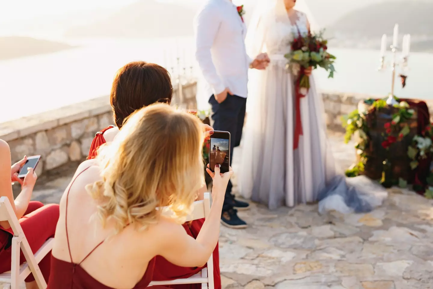 Guests are banned from taking pictures before the first kiss and reception.