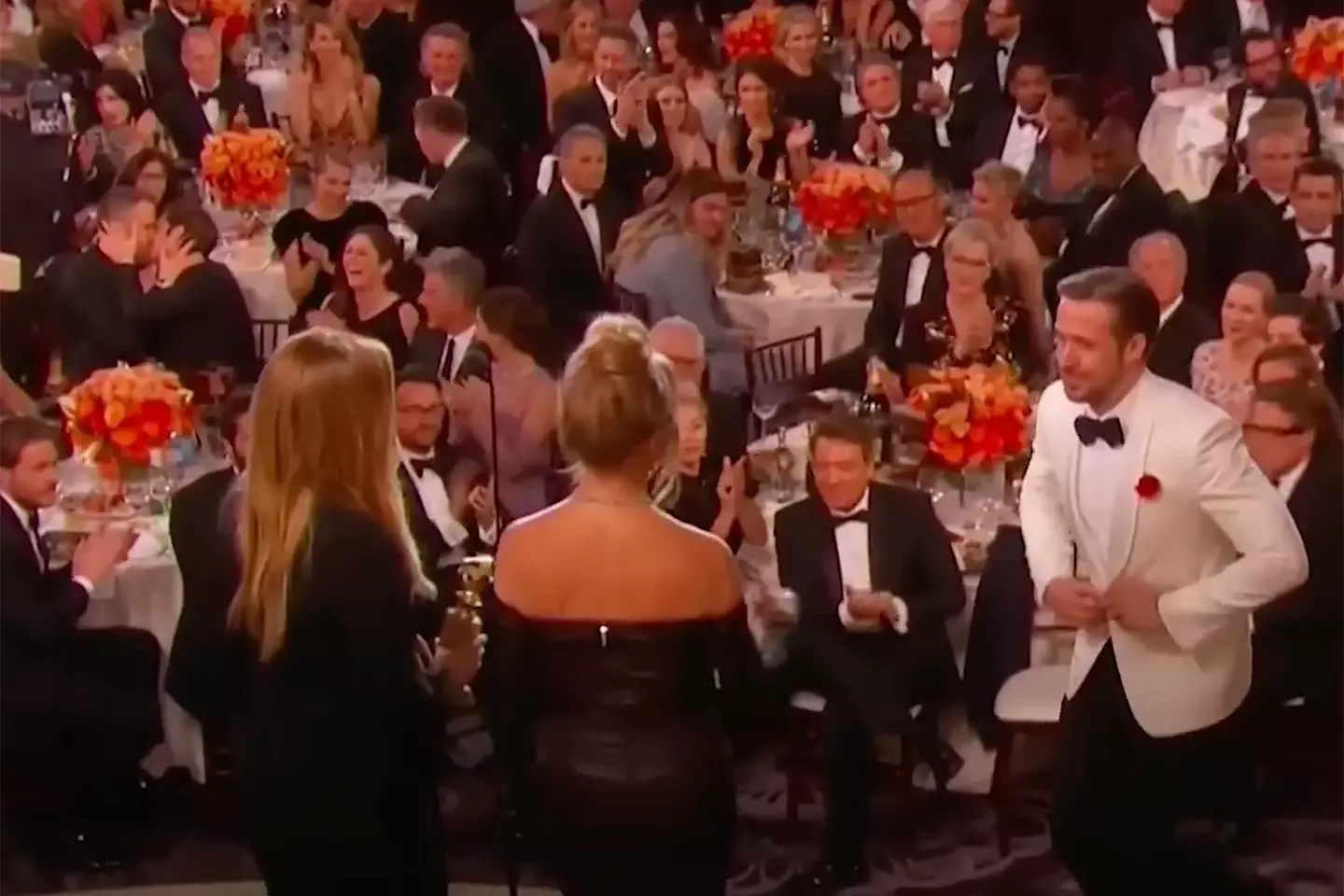 Reynolds and Garfield can be seen kissing in the left during the Golden Globes (NBC)