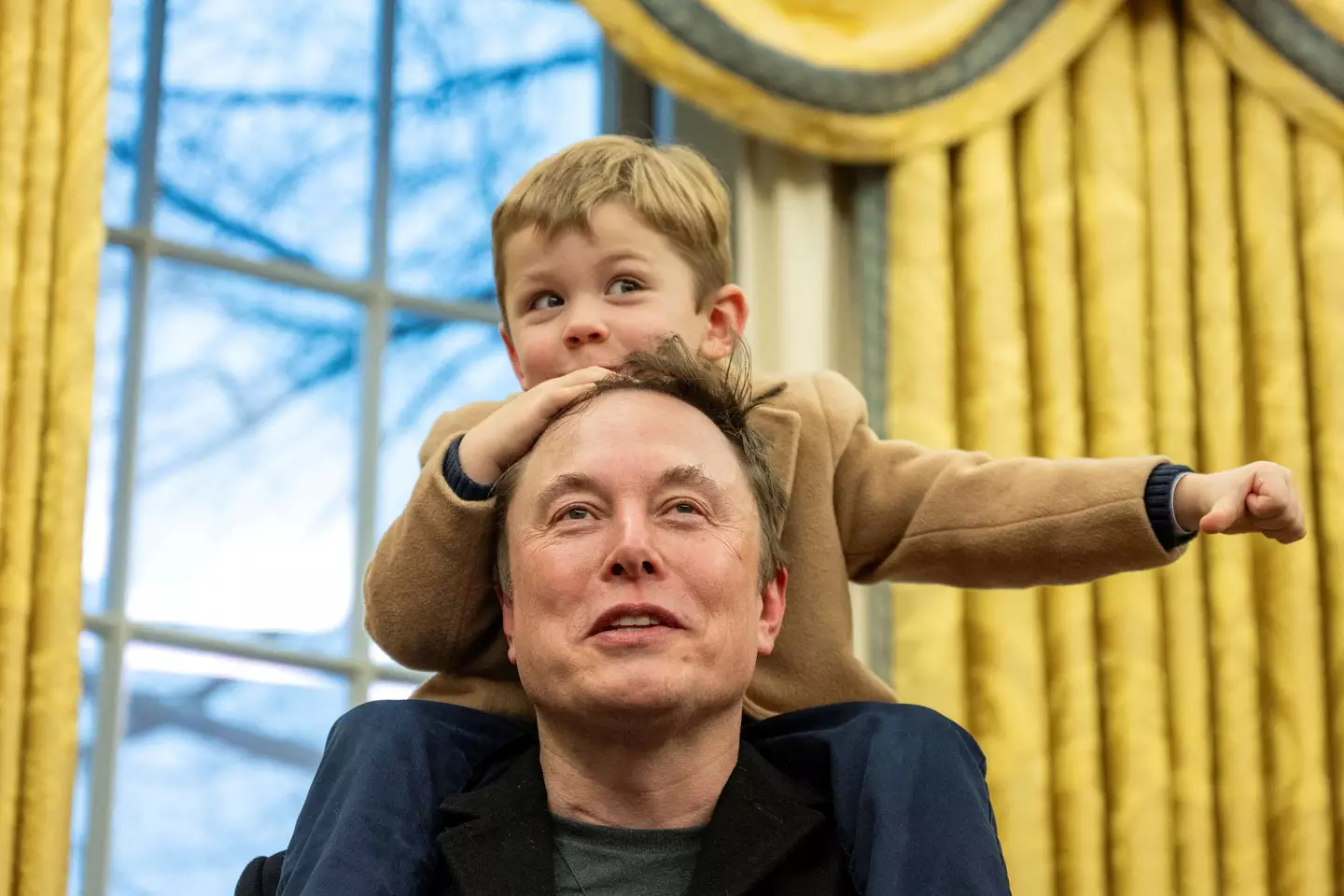 Elon Musk with his son X (JIM WATSON/AFP via Getty Images)