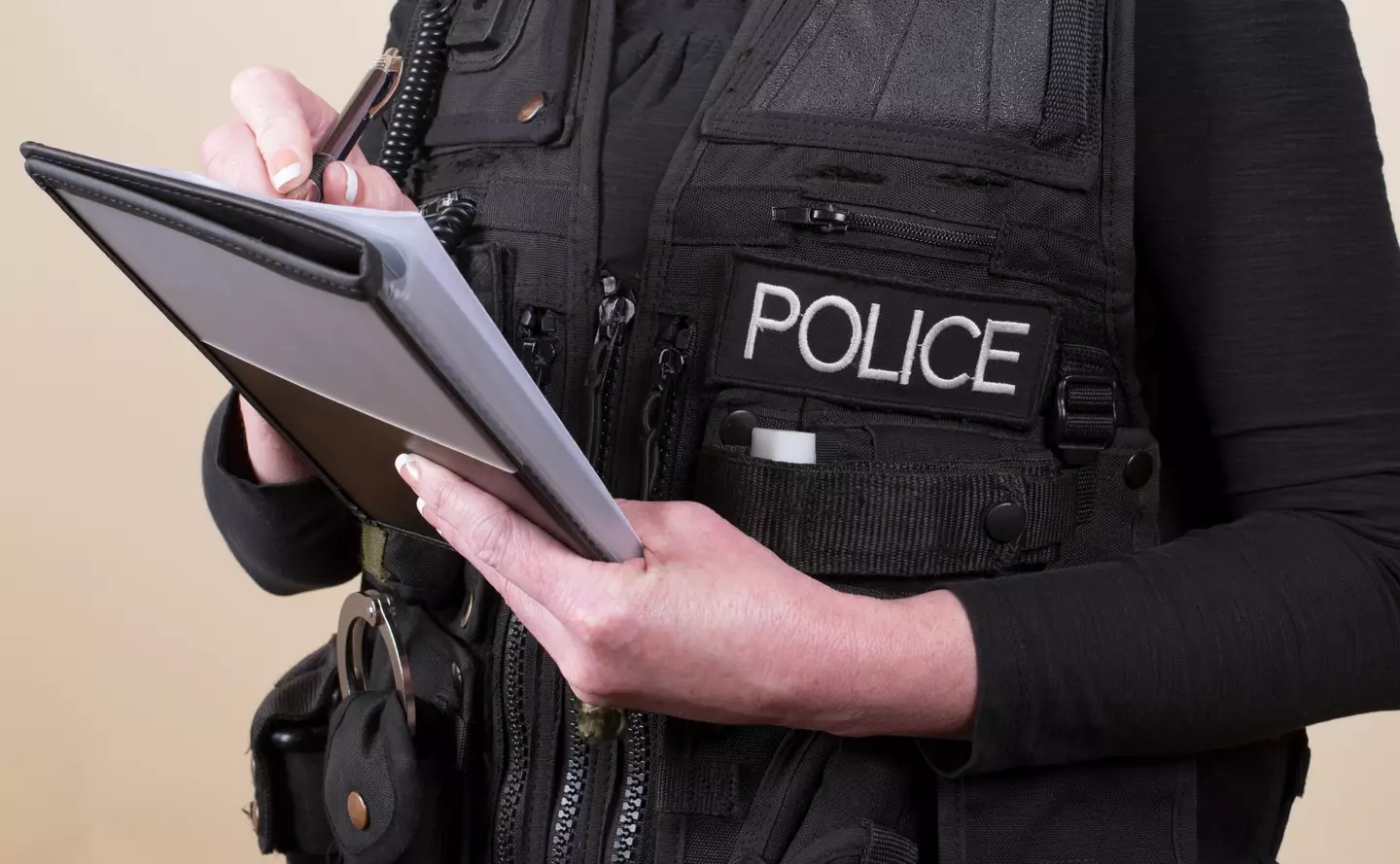 A police officer making notes.