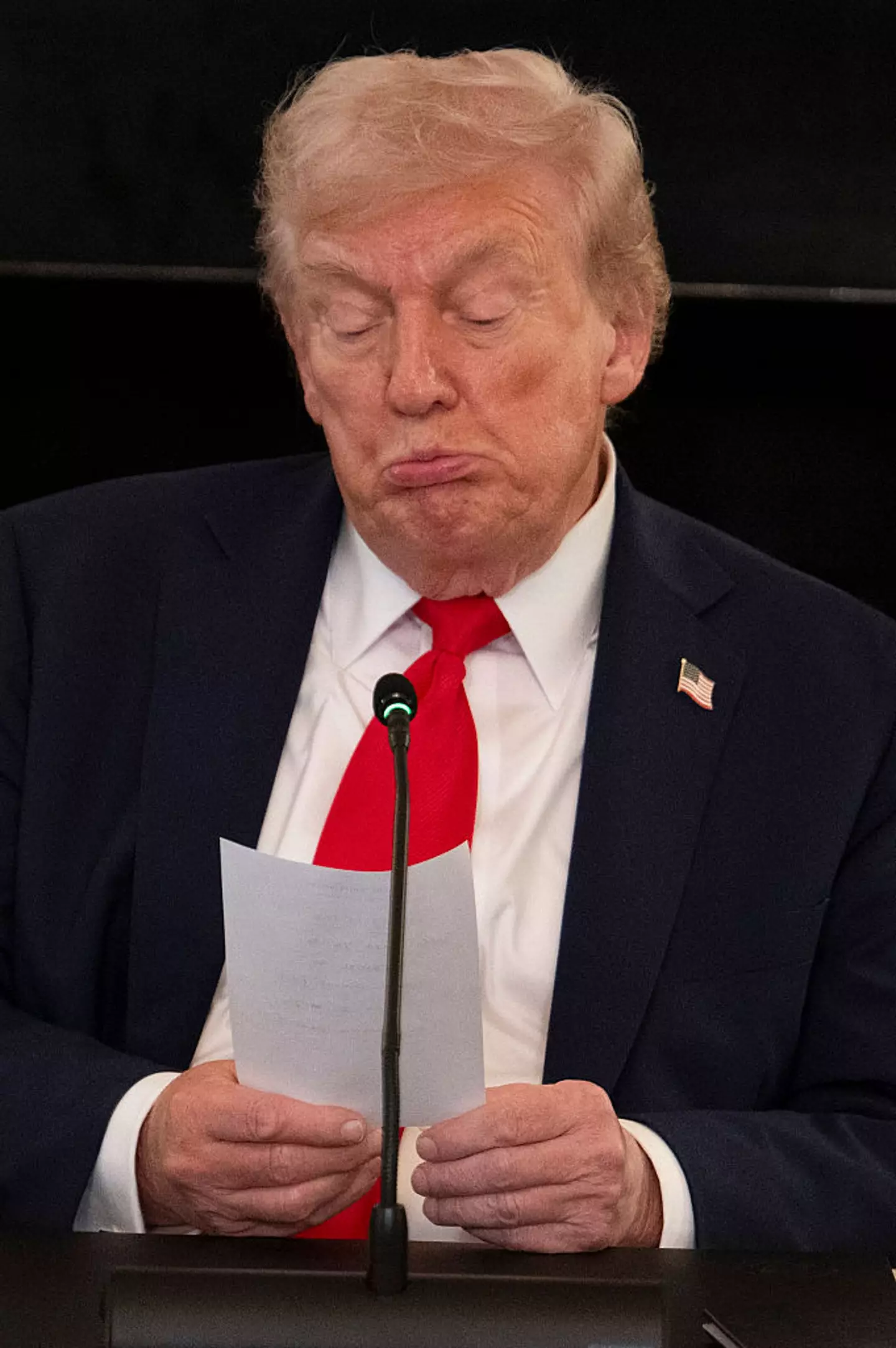 The note has prompted questions over whether Trump writes his own Truth Social posts (JIM WATSON/Getty Images)