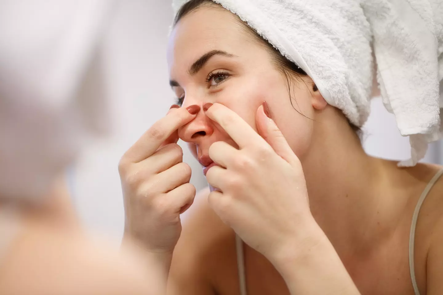The skincare expert warned over popping spots in the 'triangle of death' (zoranm / Getty Images)