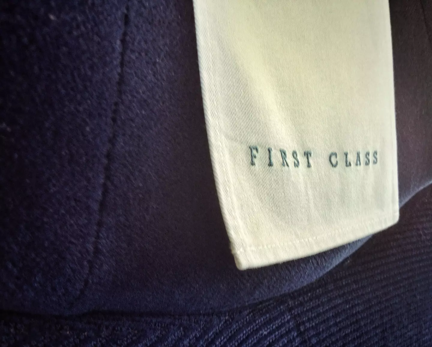 The passenger was angry having to sit next to a child in first class.