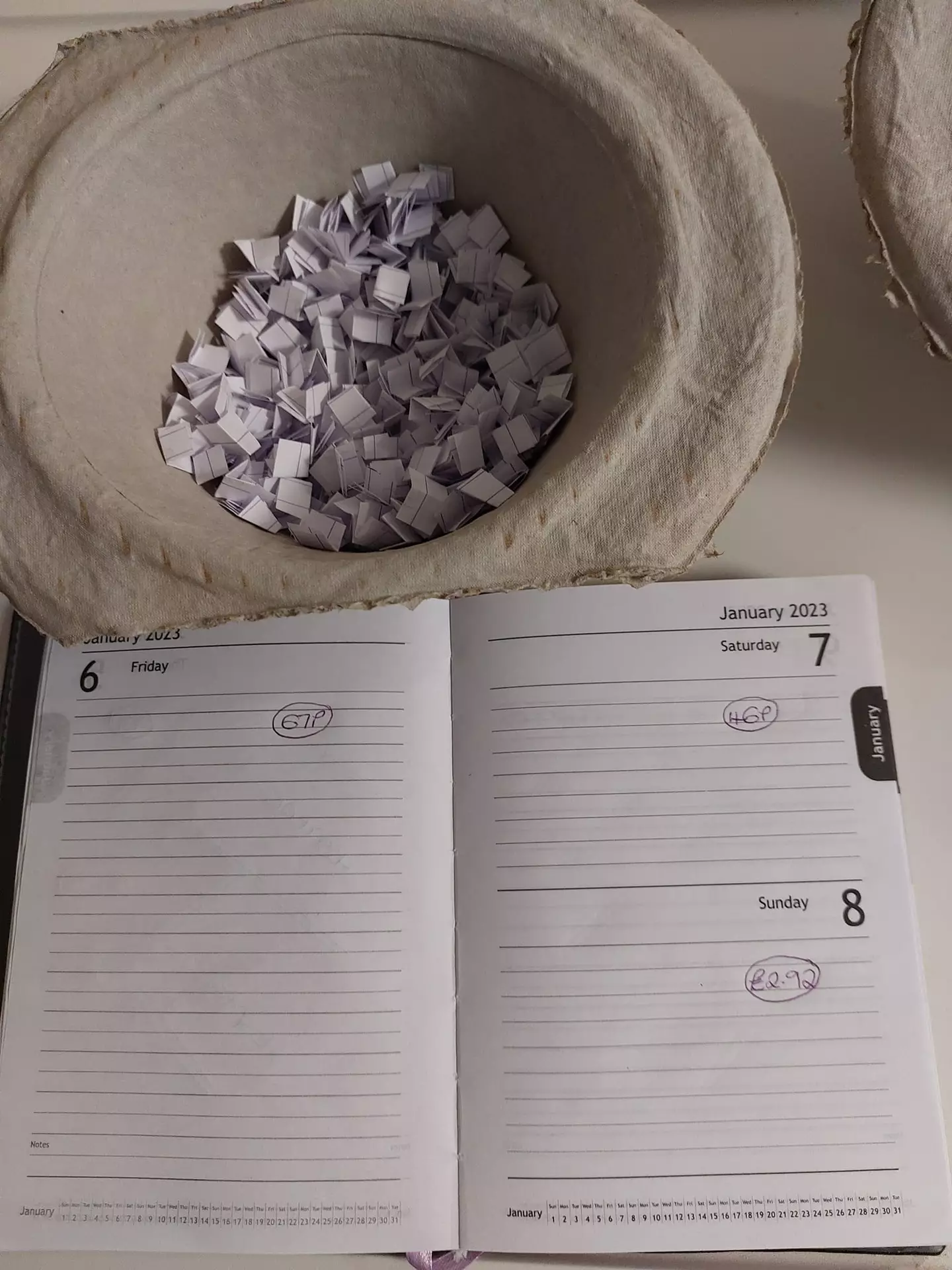 She's using her diary to help plot her savings.