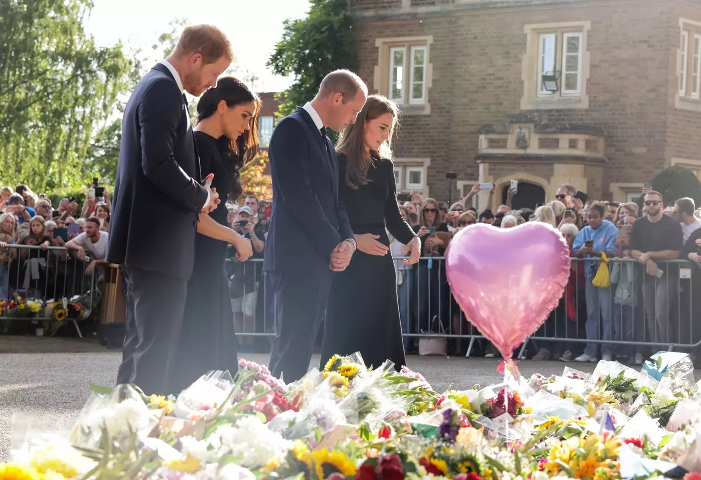 The couples viewed floral tributes for the Queen.