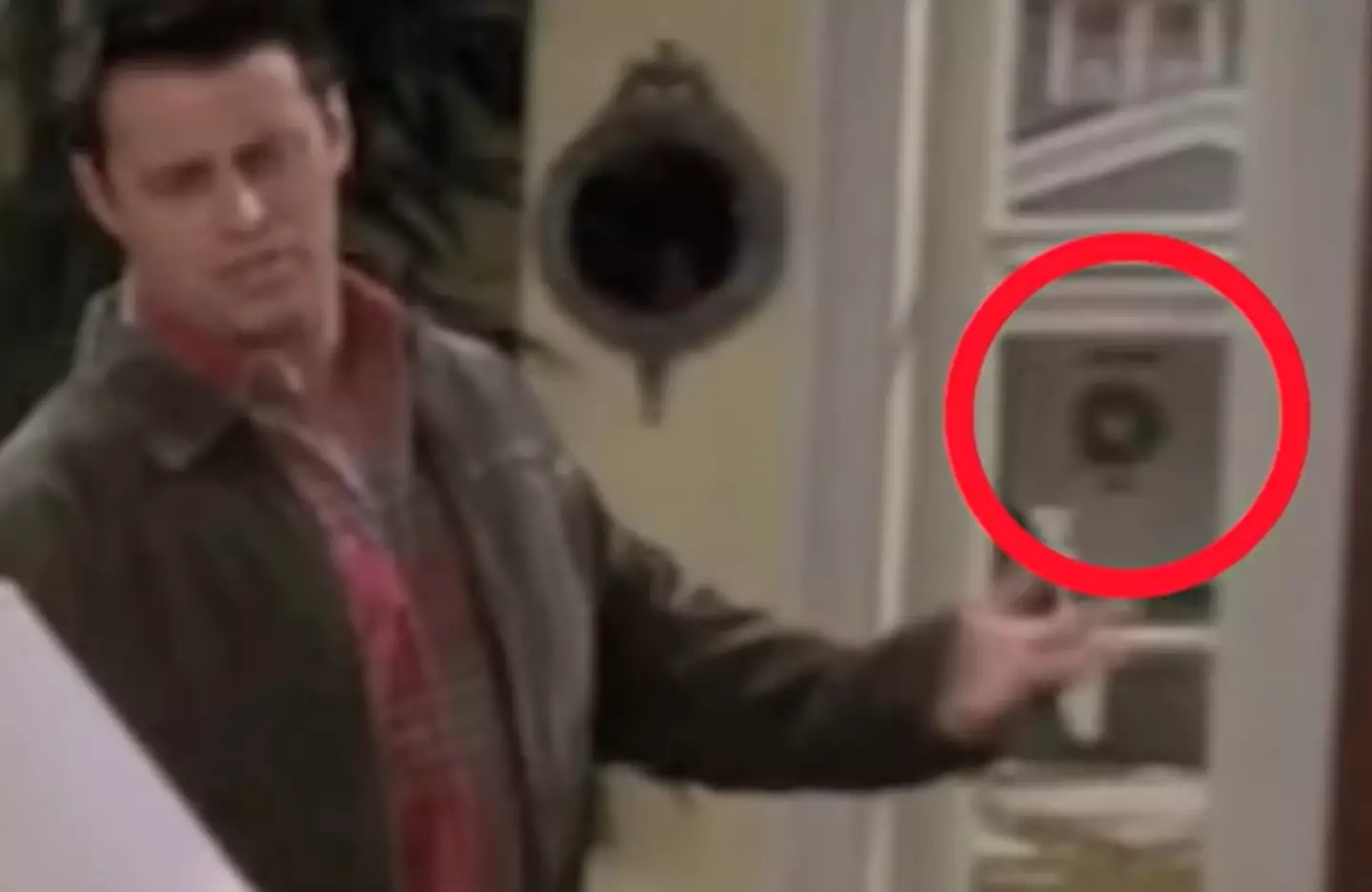 Chandler even points to the wreath across the street.