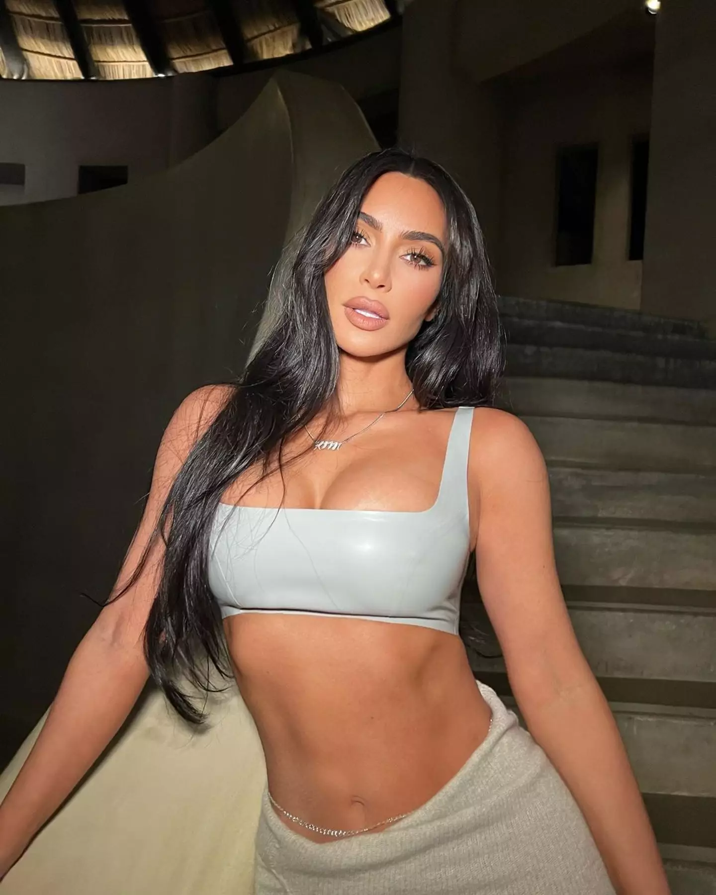 Fans debate the authenticity of Kim Kardashian's Instagram after 'unedited face' pics circulated online.