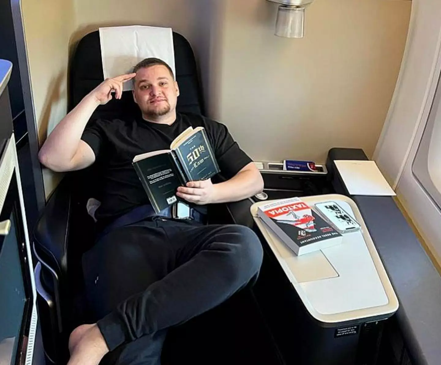 A father has sparked outrage after posting a video of him waving goodbye to his young children in economy while he and his wife enjoyed the luxuries of first class.