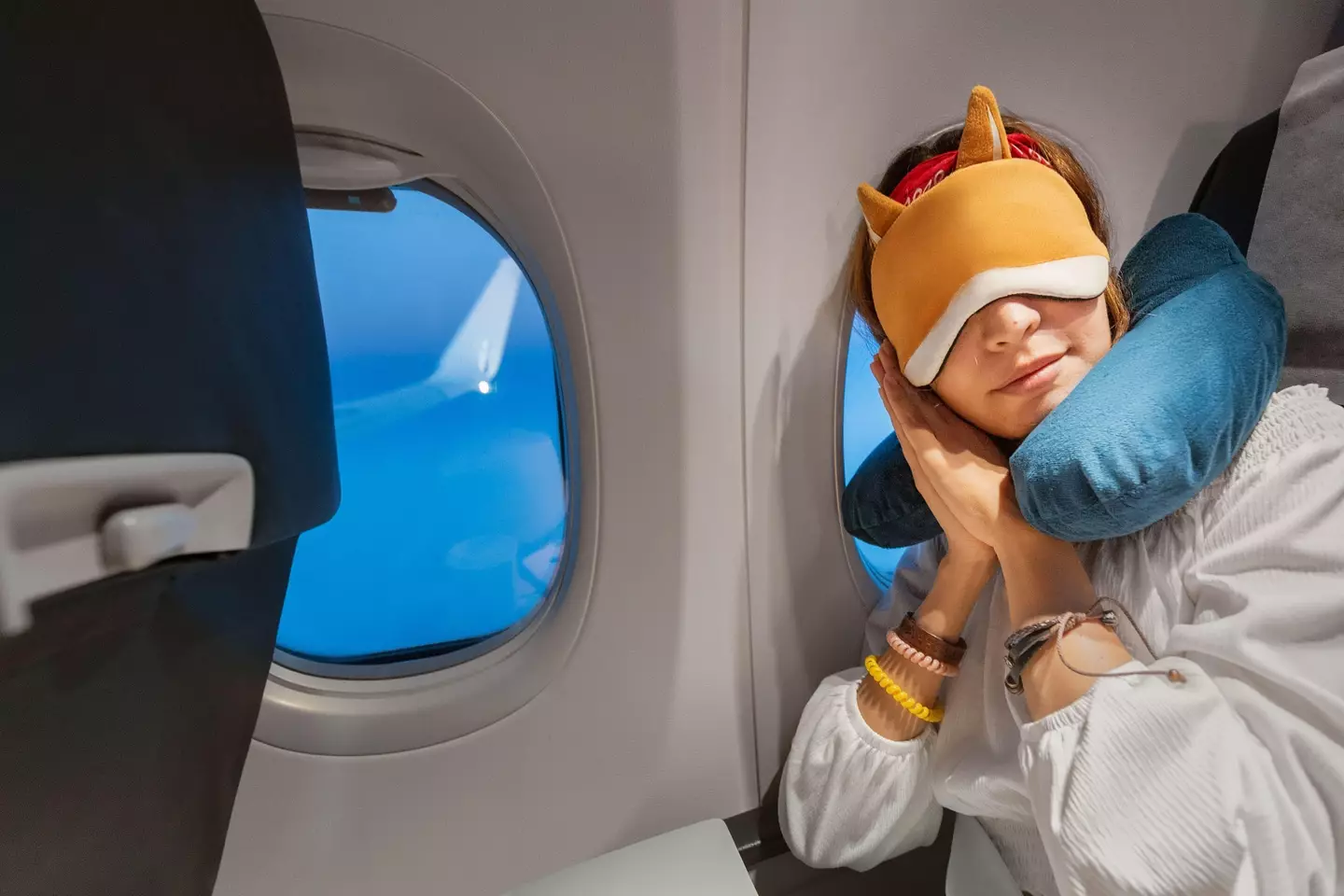 A lot of people use neck pillows to help them sleep on planes.
