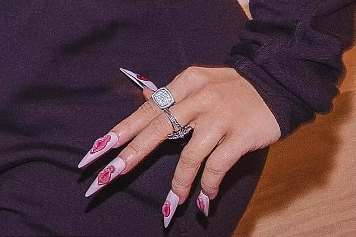 The singer was simultaneously rocking 'vagina' artwork on her long nails.