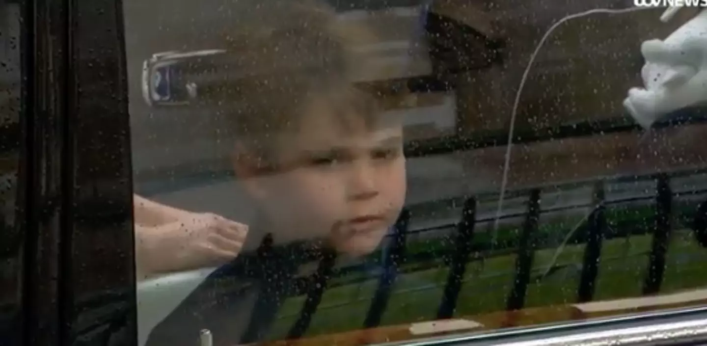 Prince Louis waved from the car.
