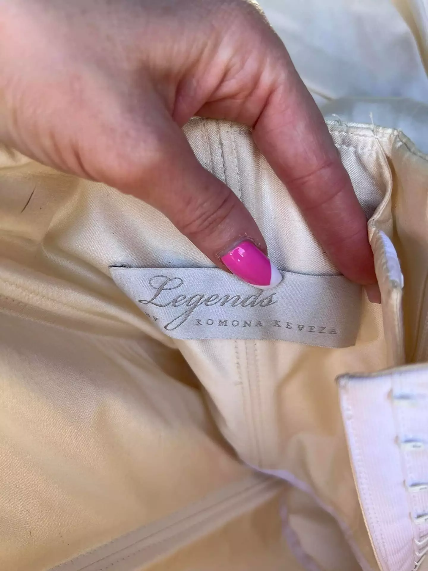 The dress is an authentic designer piece.