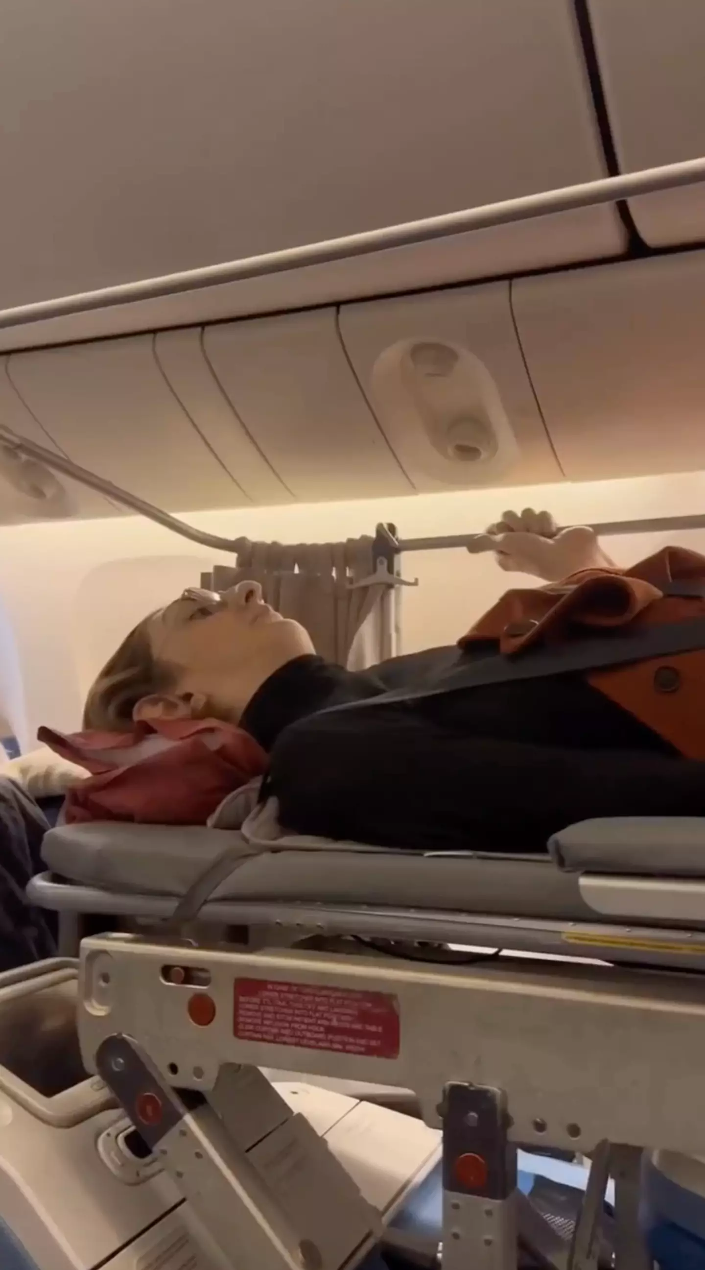 The world's tallest woman then lay horizontally in the bed during the flight.