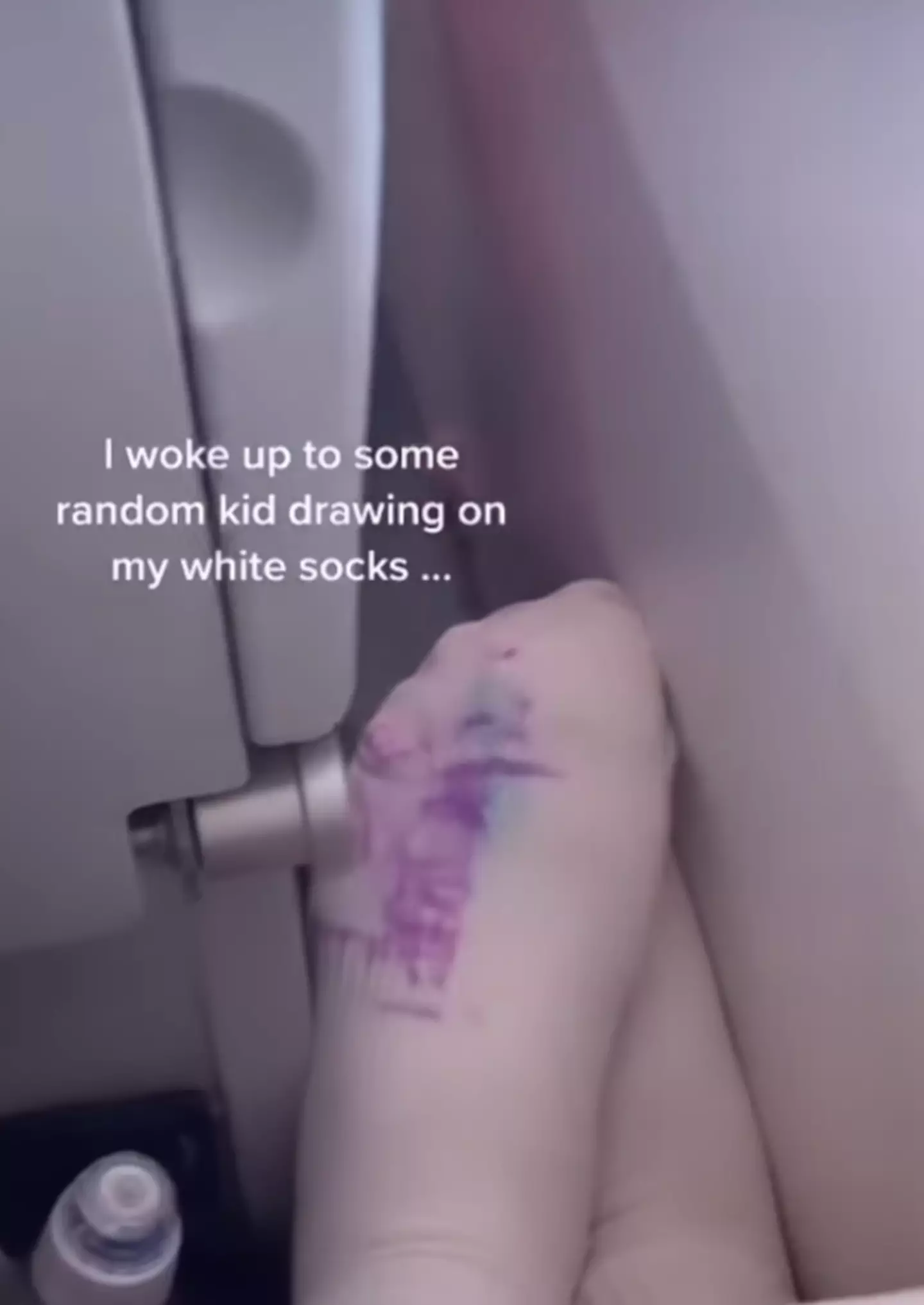 People said the woman shouldn't have had her feet on the armrest.