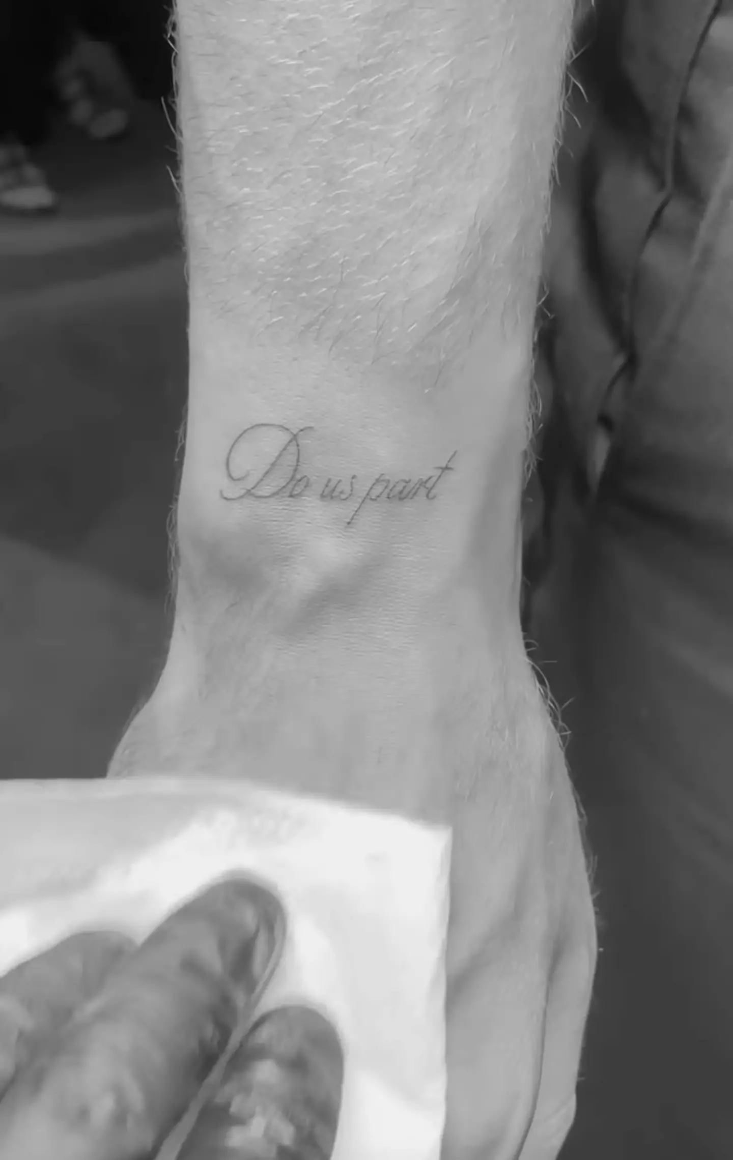The tattoos read 'Til death' and 'Do us part'.