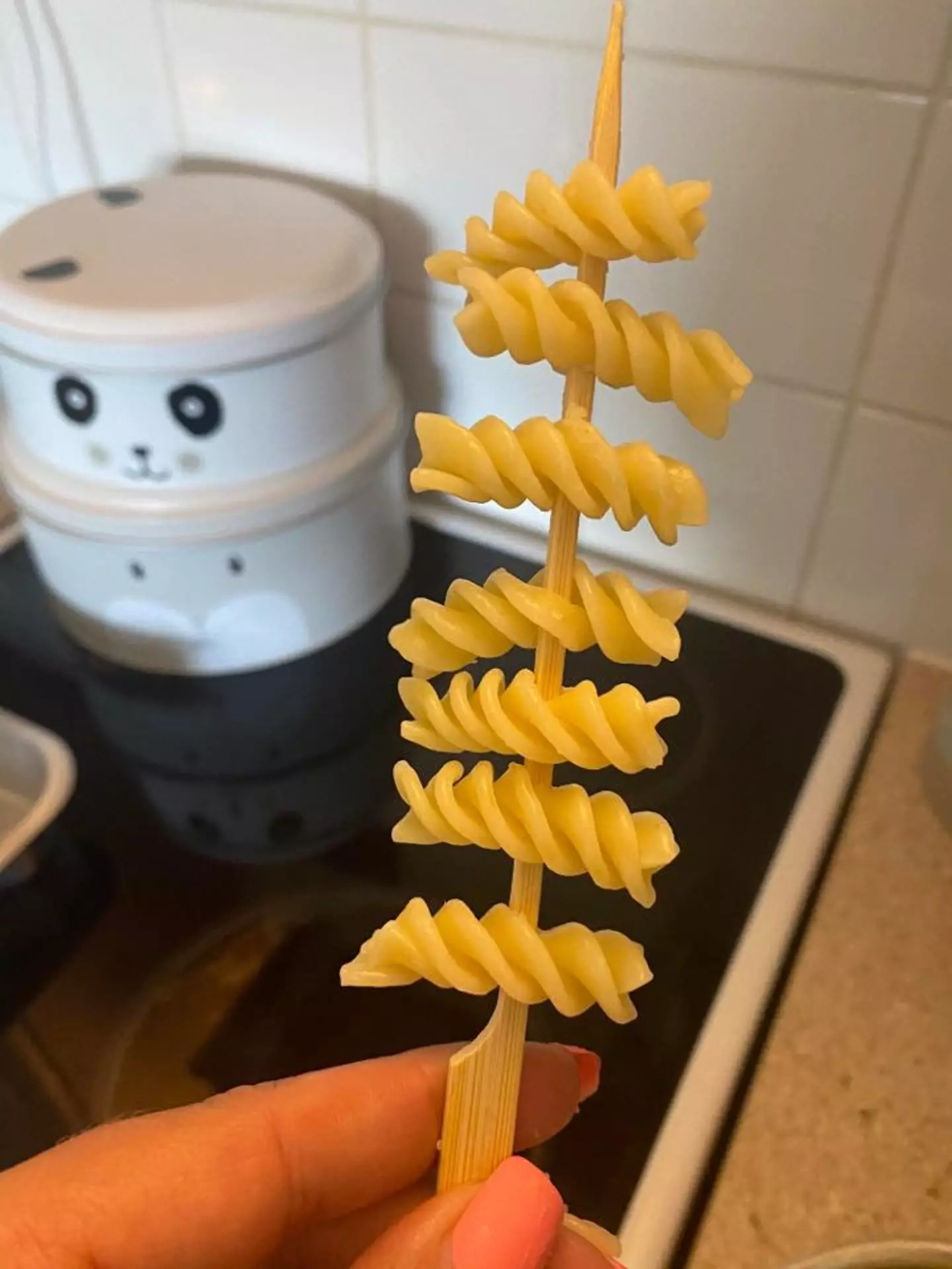 Simply skewer the pasta before adding sauce and cheese (