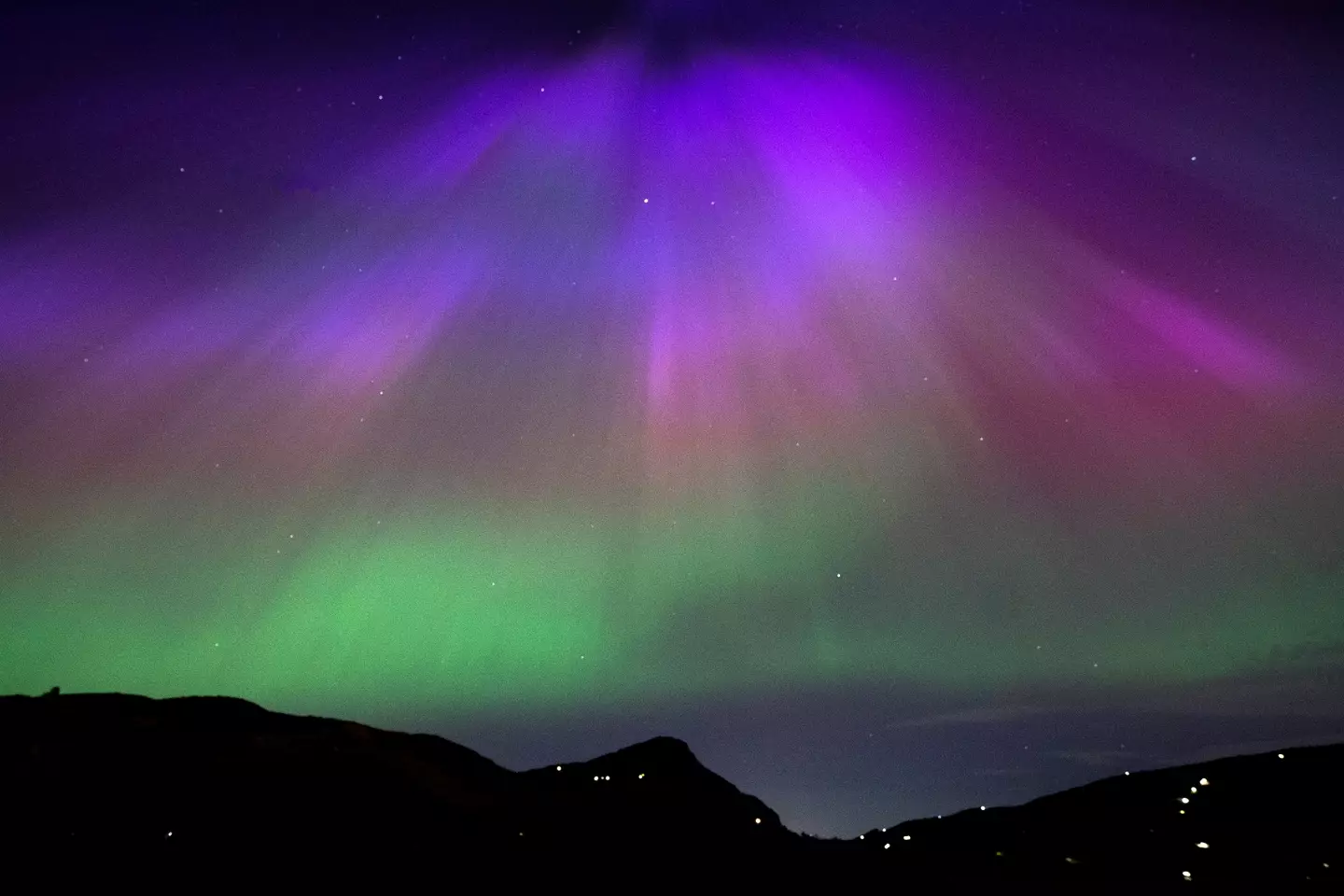 The aurora borealis above Arthur’s Seat and Salisbury Crags in Holyrood Park, Edinburgh (PA)