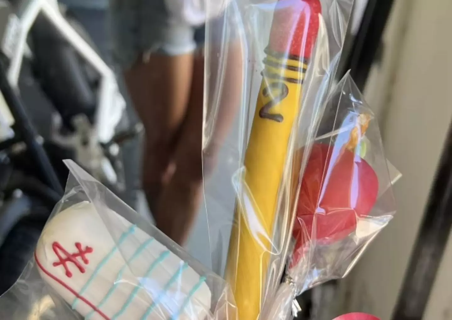 The gift in question, a selection of sugary treats in the shape of a graded paper, pencil and apple for the teacher.