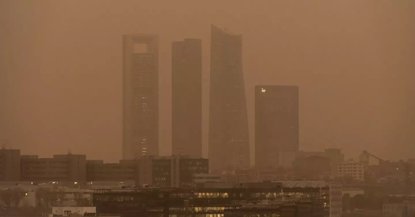 The city of Madrid was covered in an orange mist on Tuesday. (