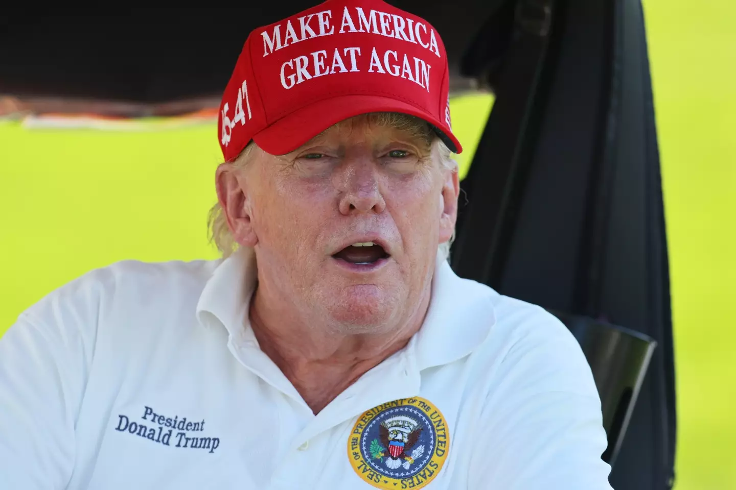 One of Donald Trump's golf caddies once put a man in a 'choke hold' after he spoke his mind on the president (Mike Stobe/Getty Images)