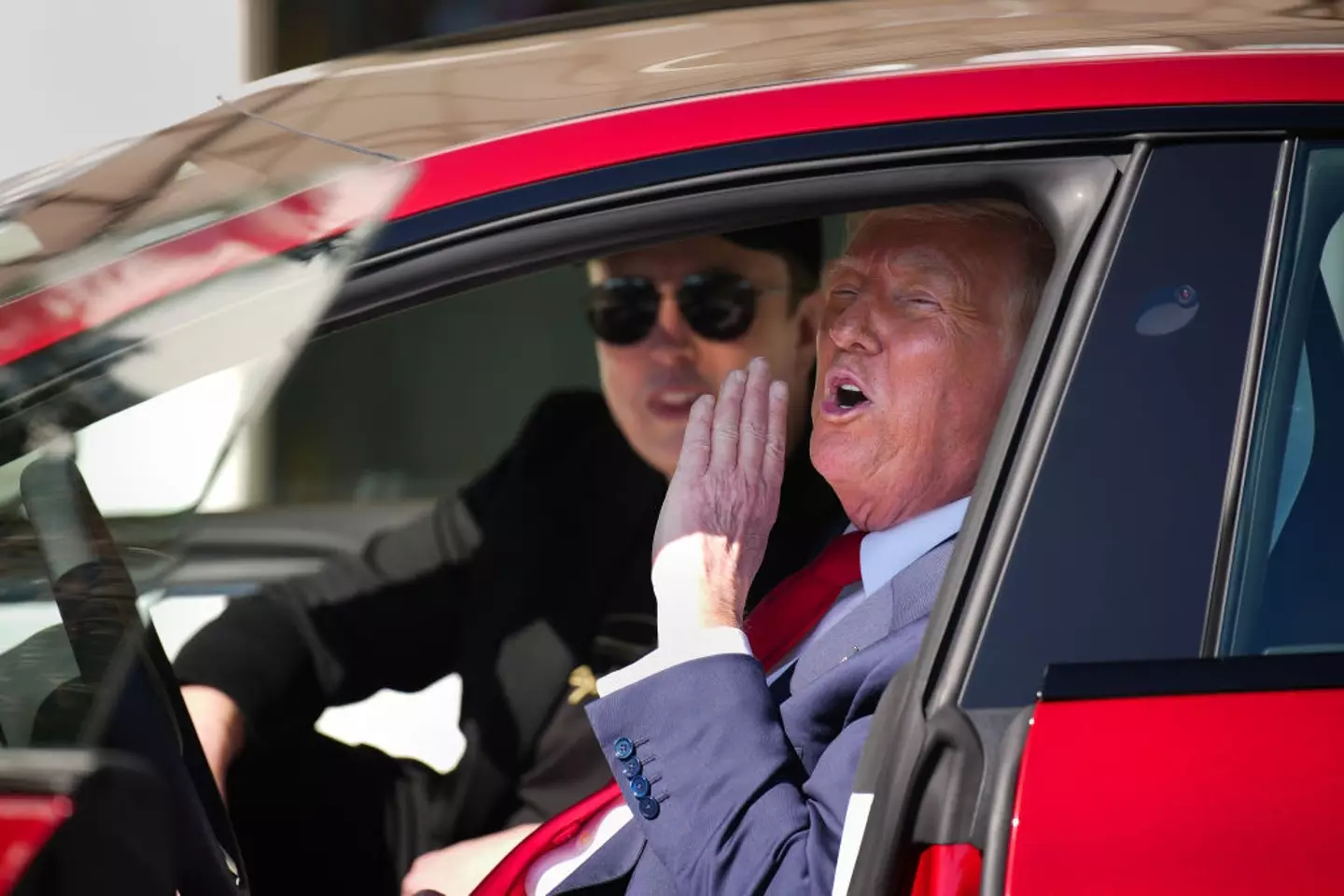 Donald Trump has urged fans to 'show support' to billionaire Elon Musk and buy a Tesla (Andrew Harnik / Staff / Getty Images)