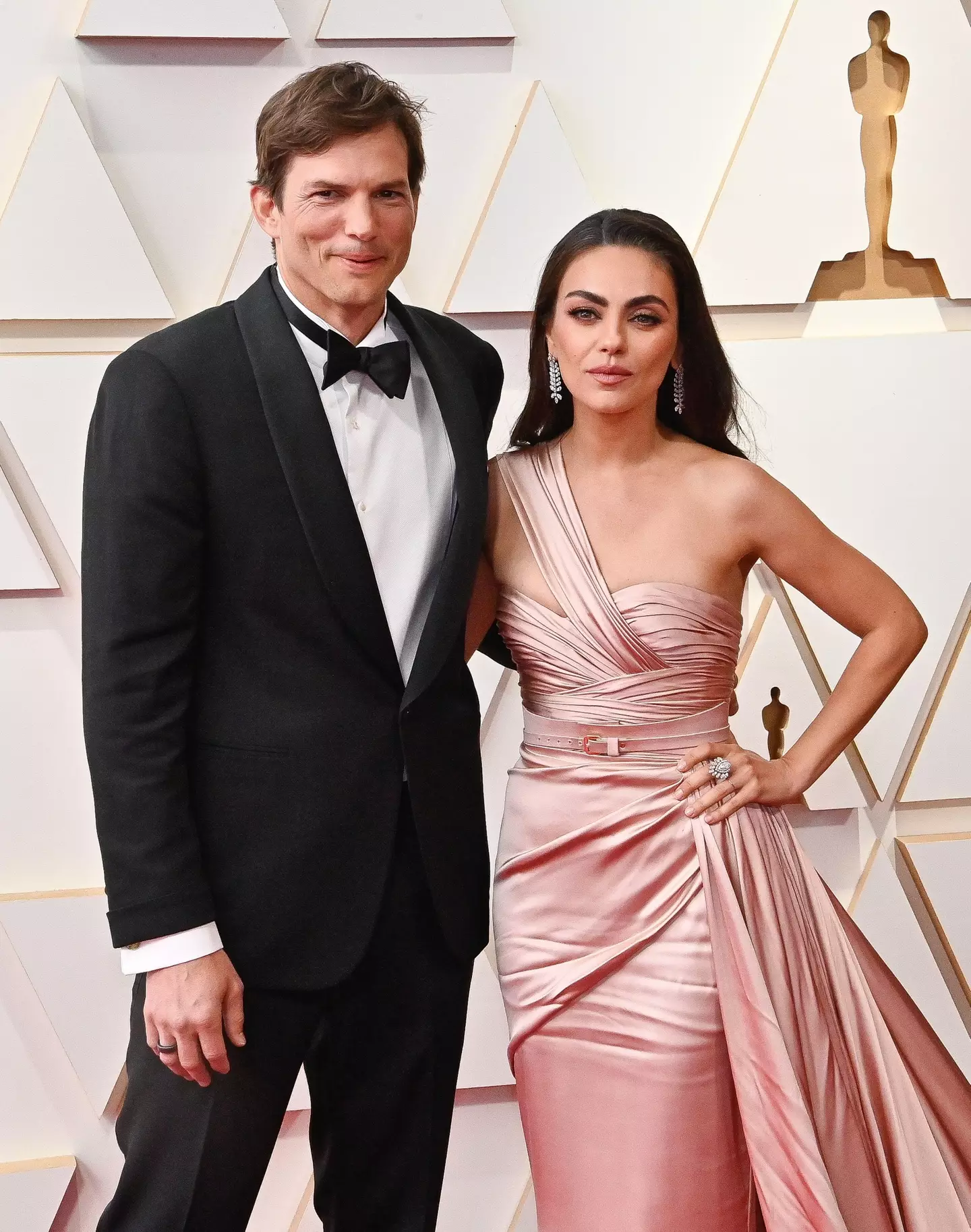 Ashton Kutcher with his wife Mila Kunis at the 94th Academy Awards.