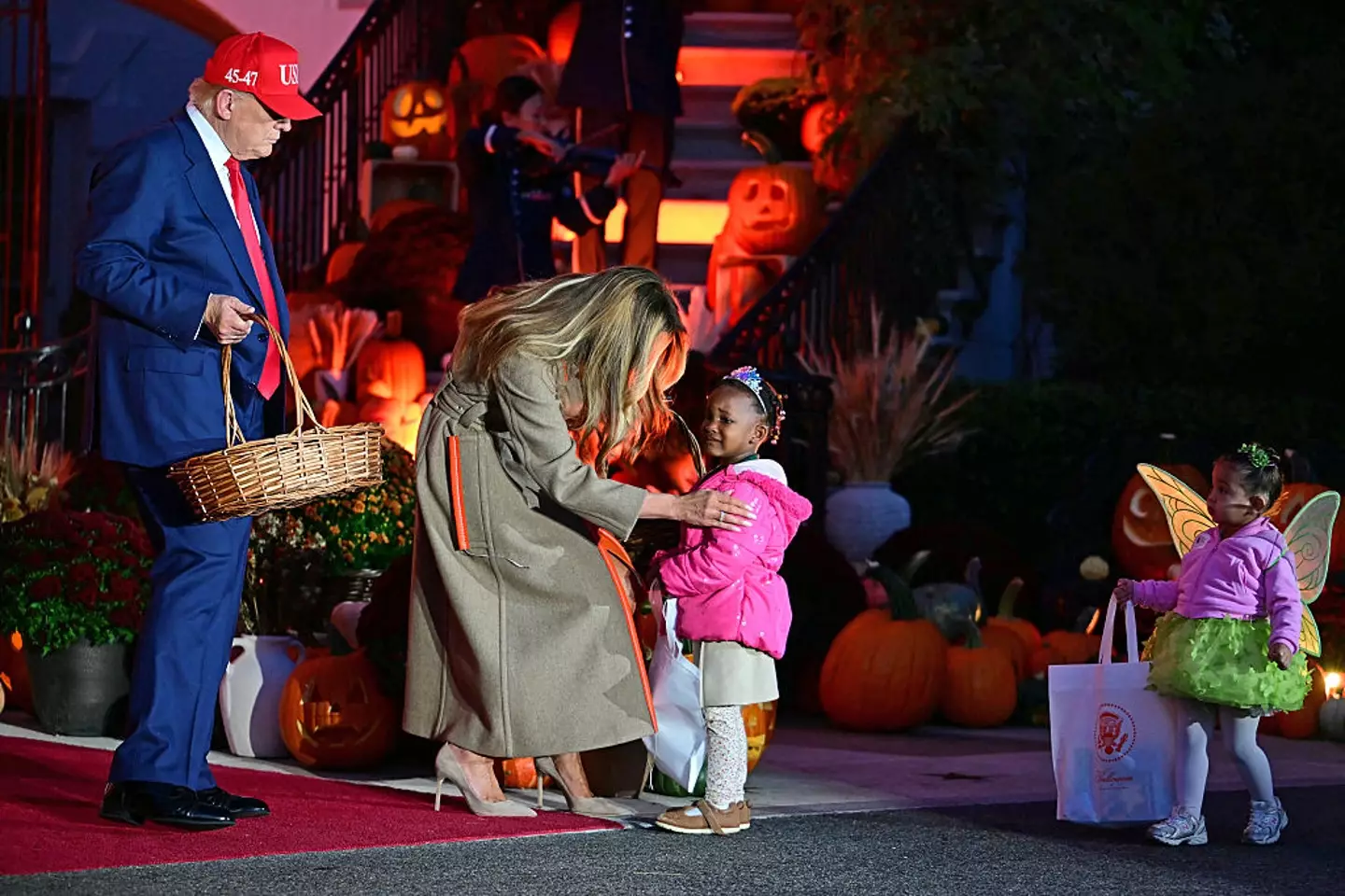 Melania made sure to comfort a little girl who was scared (JIM WATSON/Getty Images)