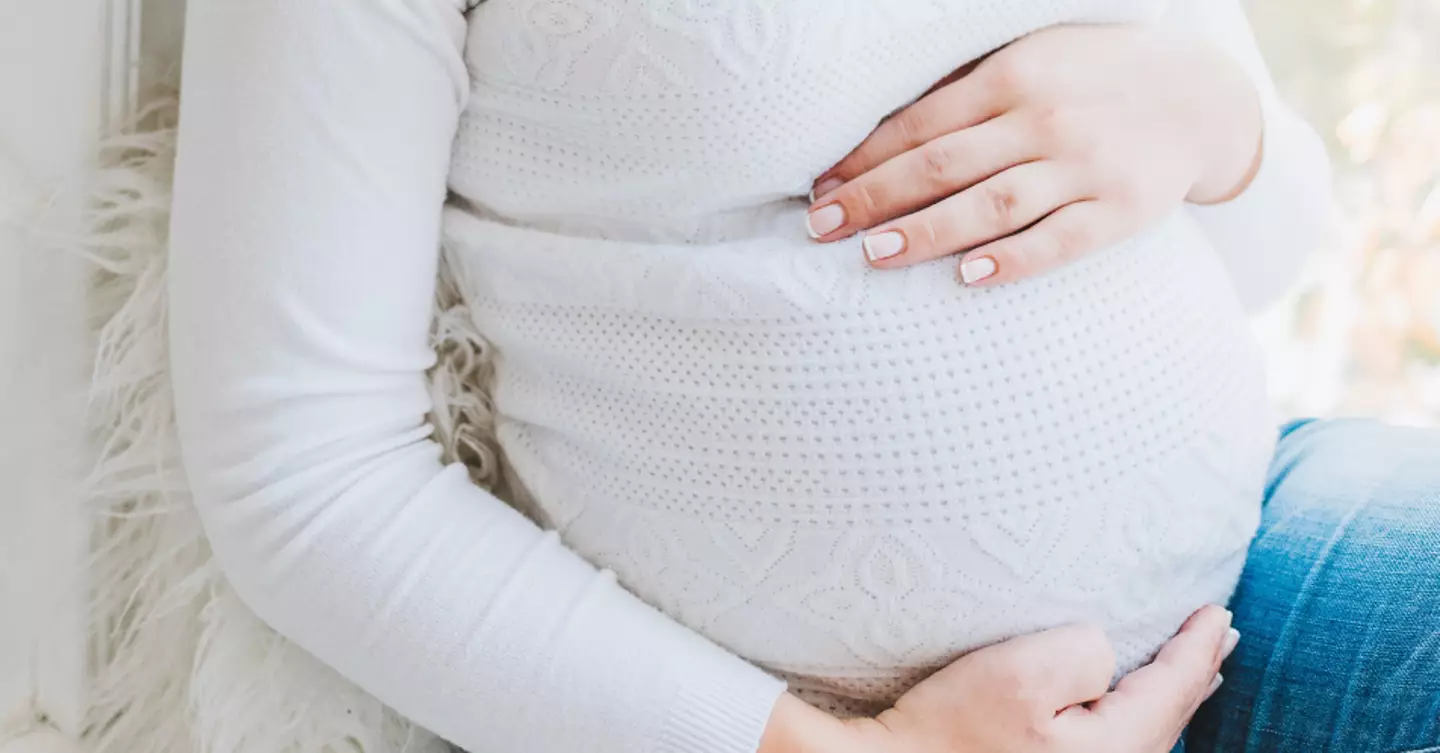 A pregnant woman has sued her company after being denied a pay rise.