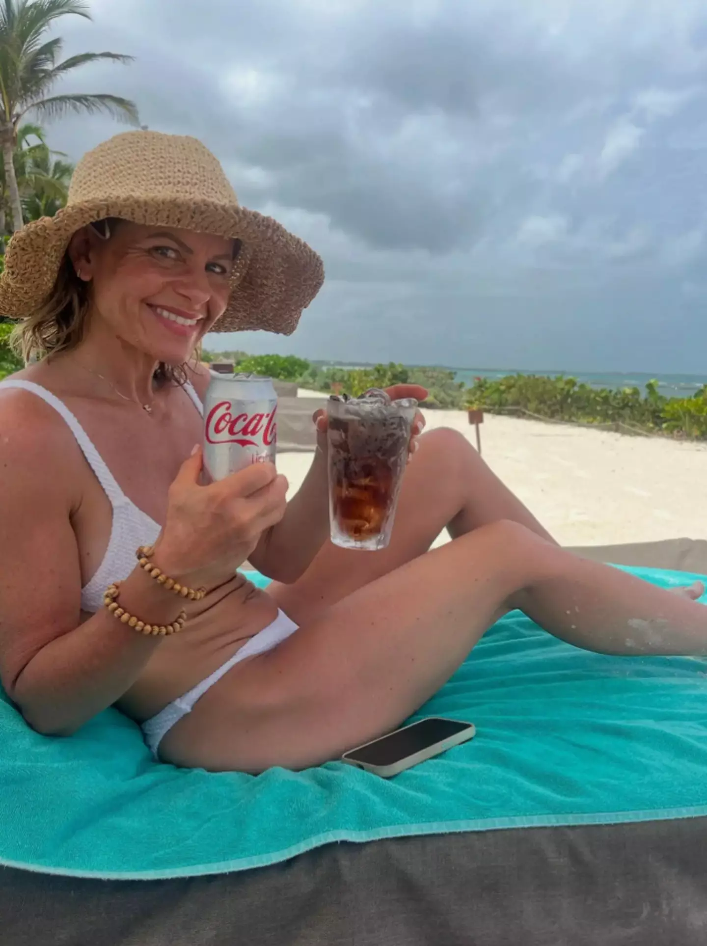 Candace Cameron Bure posed beside the beach in a white swimsuit (Instagram/@candacecbure)