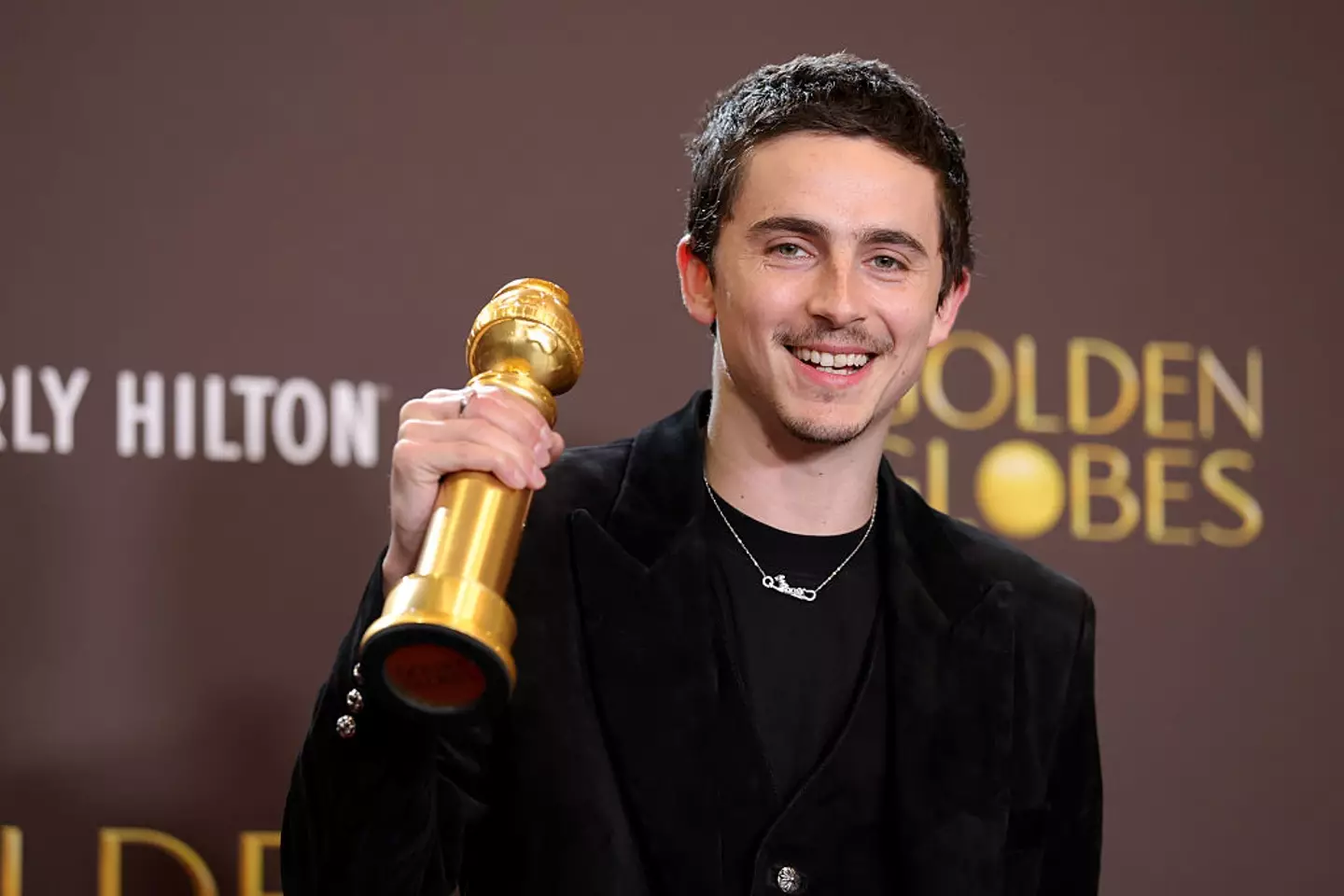 Timothée Chalamet has won Best Actor in a Musical or Comedy for Marty Supreme (Frazer Harrison / Staff / Getty Images)