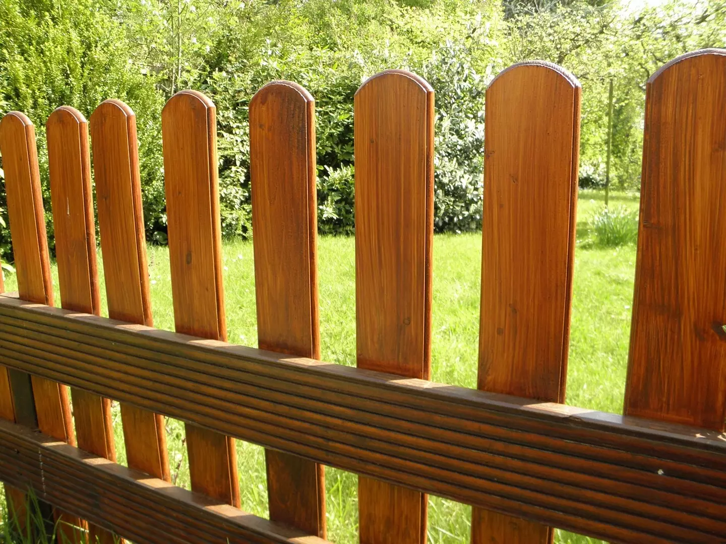 The woman's fence surrounded her garden.