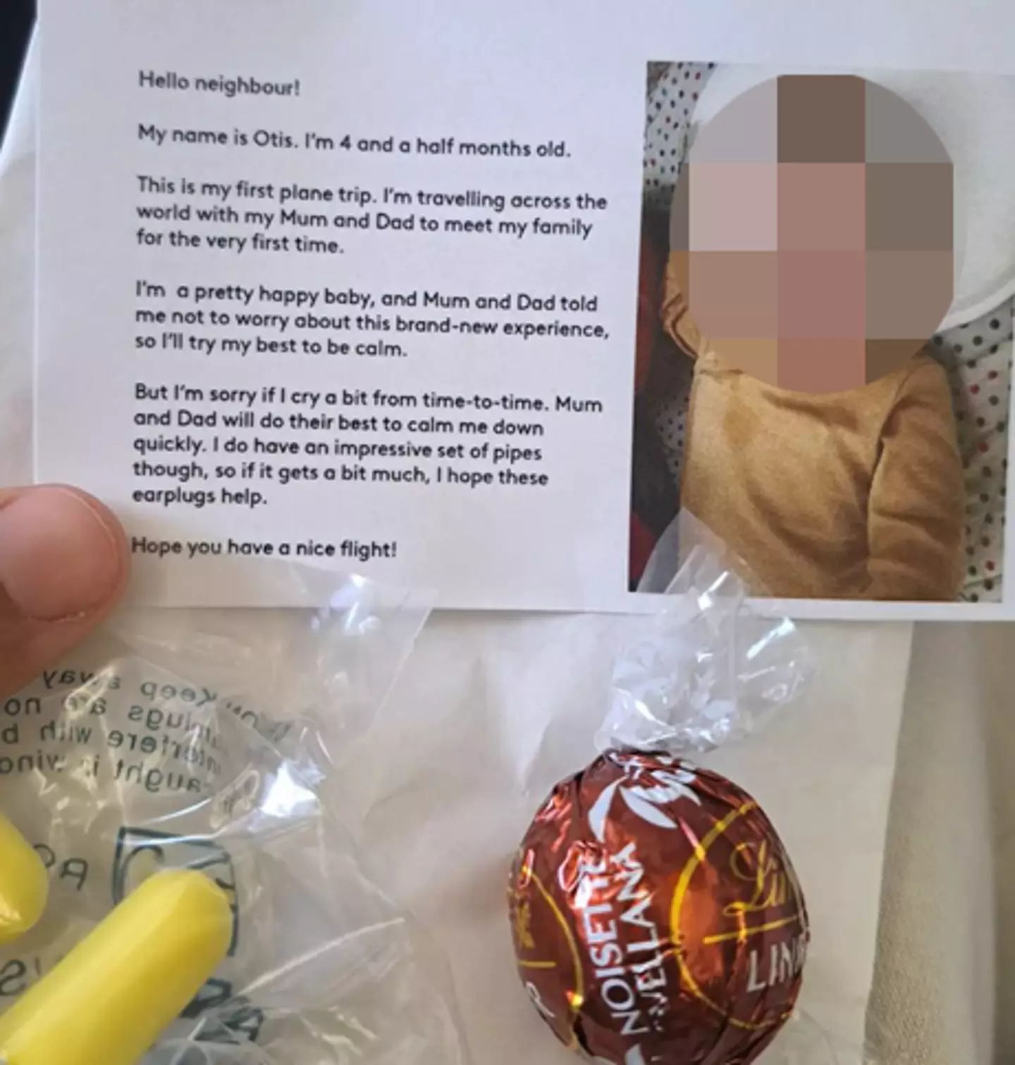 The parents handed out the packages to nearby passengers.