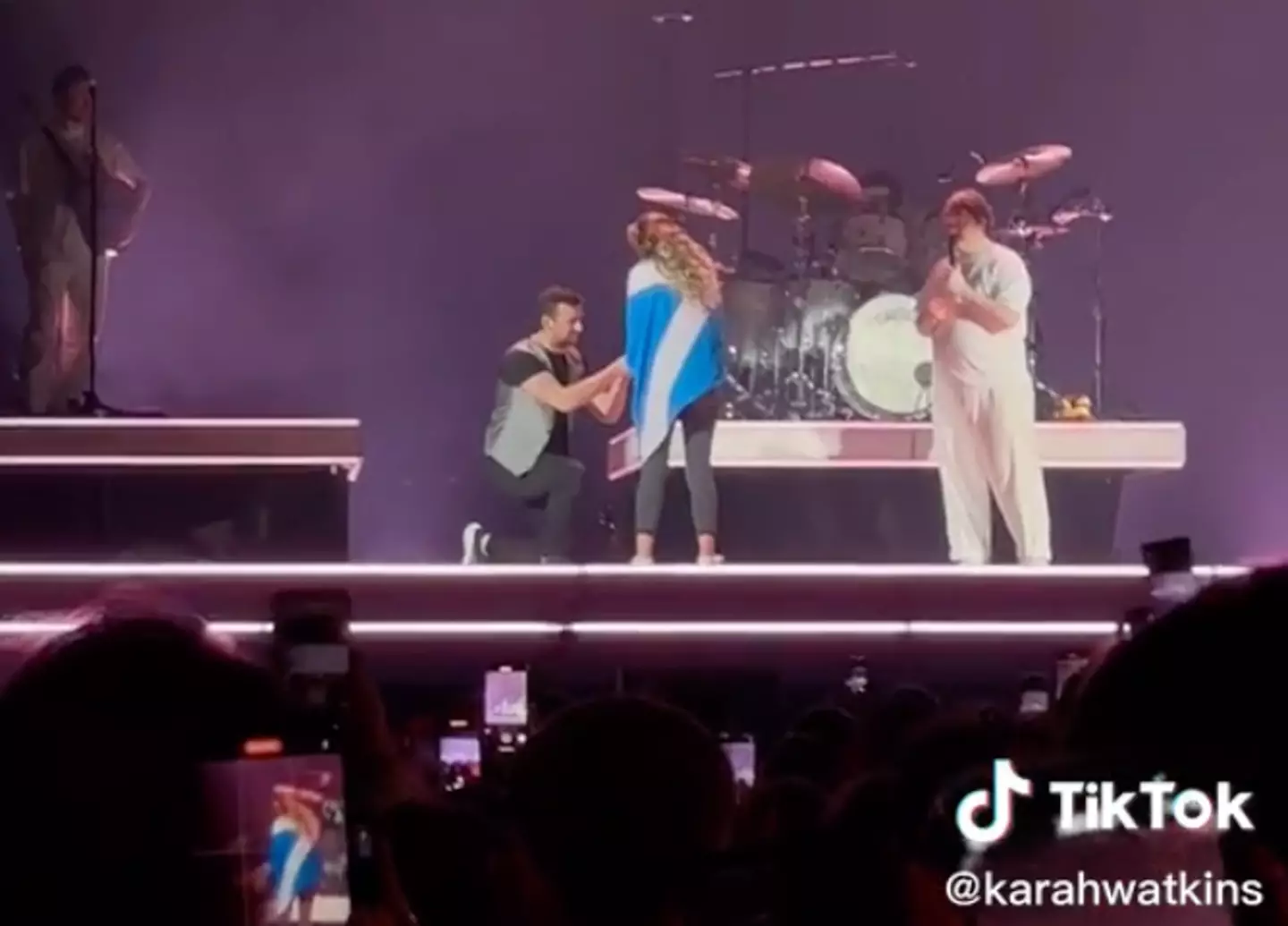 Sam swiftly got down on one knee.