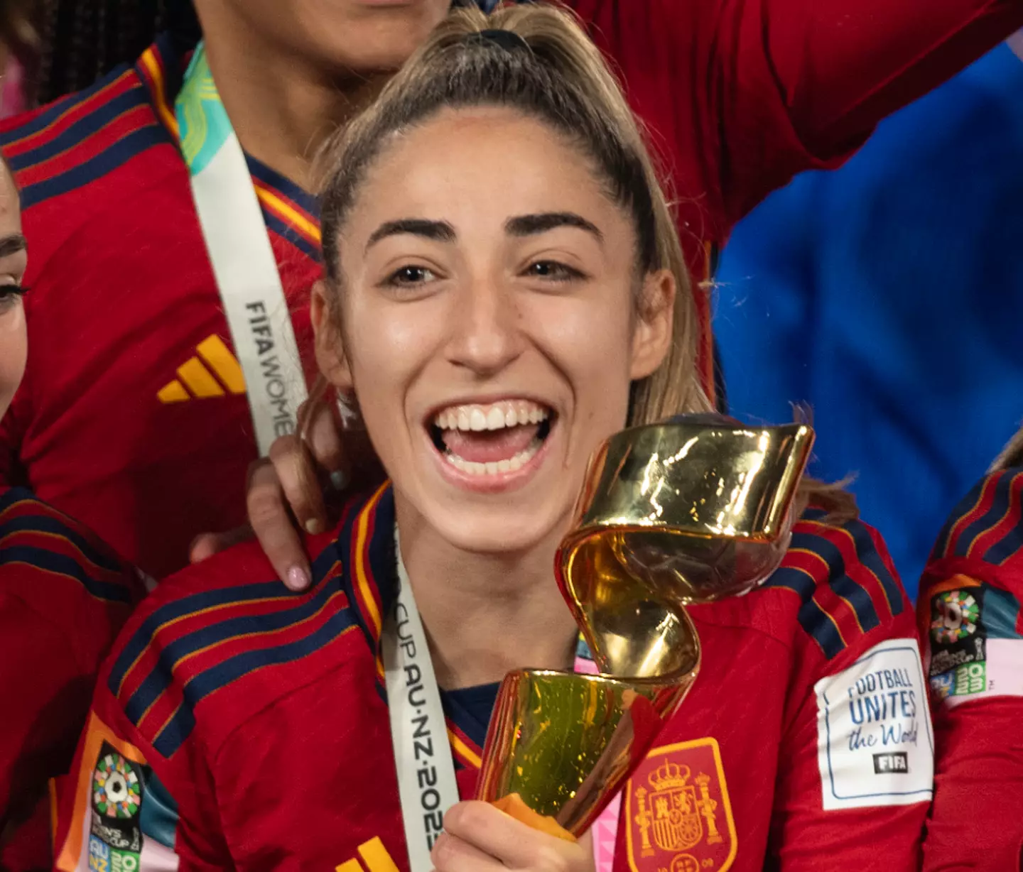 Olga Carmona joined her team in celebrating Spain's win.