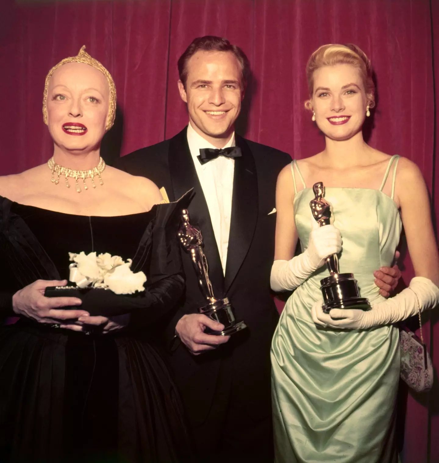 Bette Davis, Marlon Brando and Grace Kelly at the 1955 Oscars.